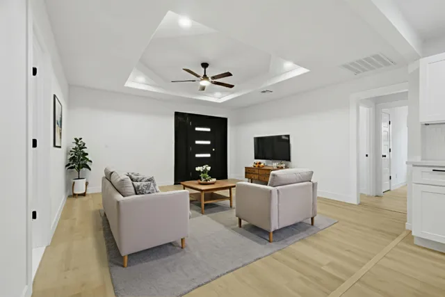 a kitchen with white cabinets and white appliances