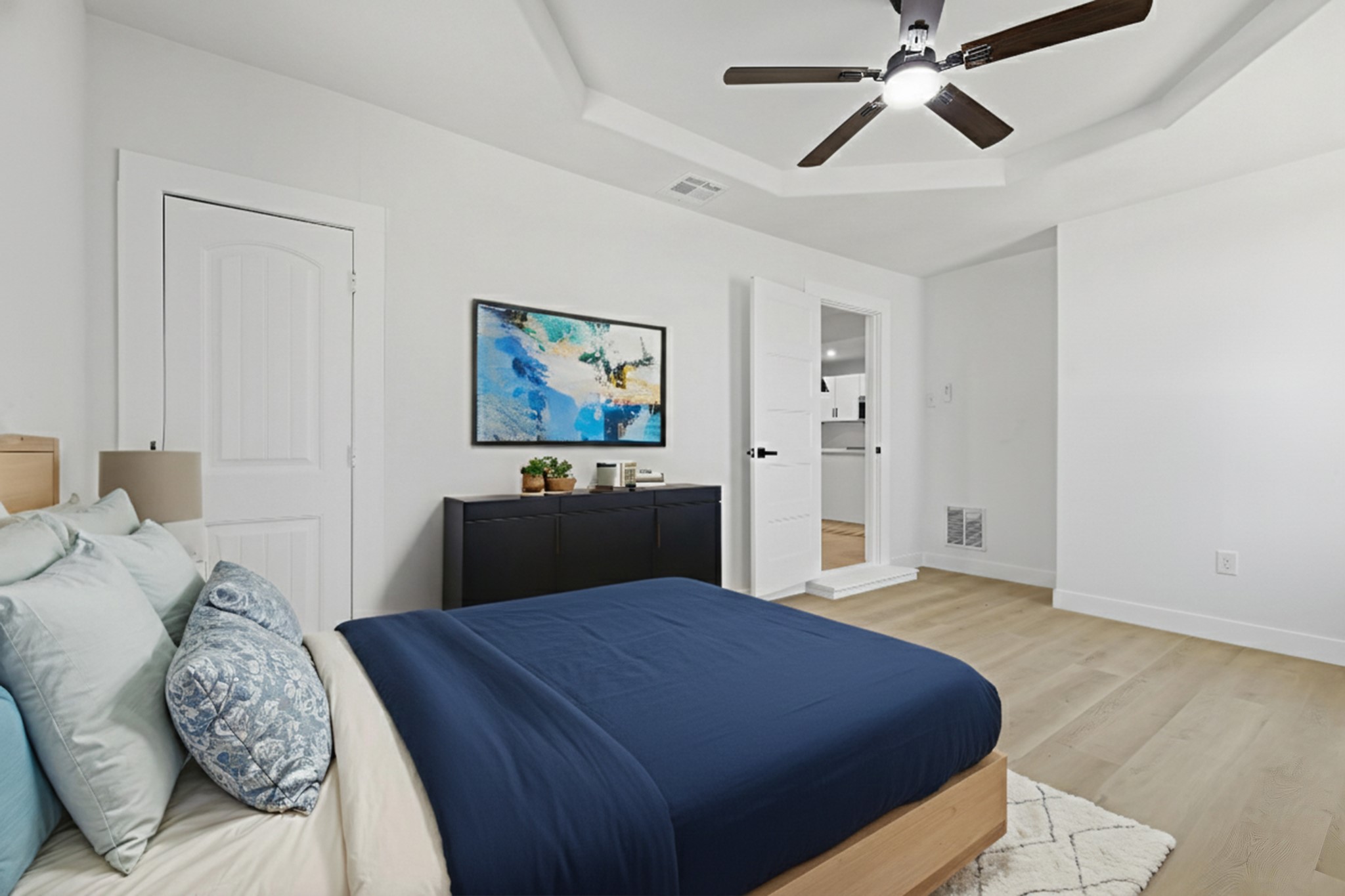 2716 Windsor Lane Pasadena, TX 77506 - Photo 8 of 22 a bedroom with a bed and a chandelier