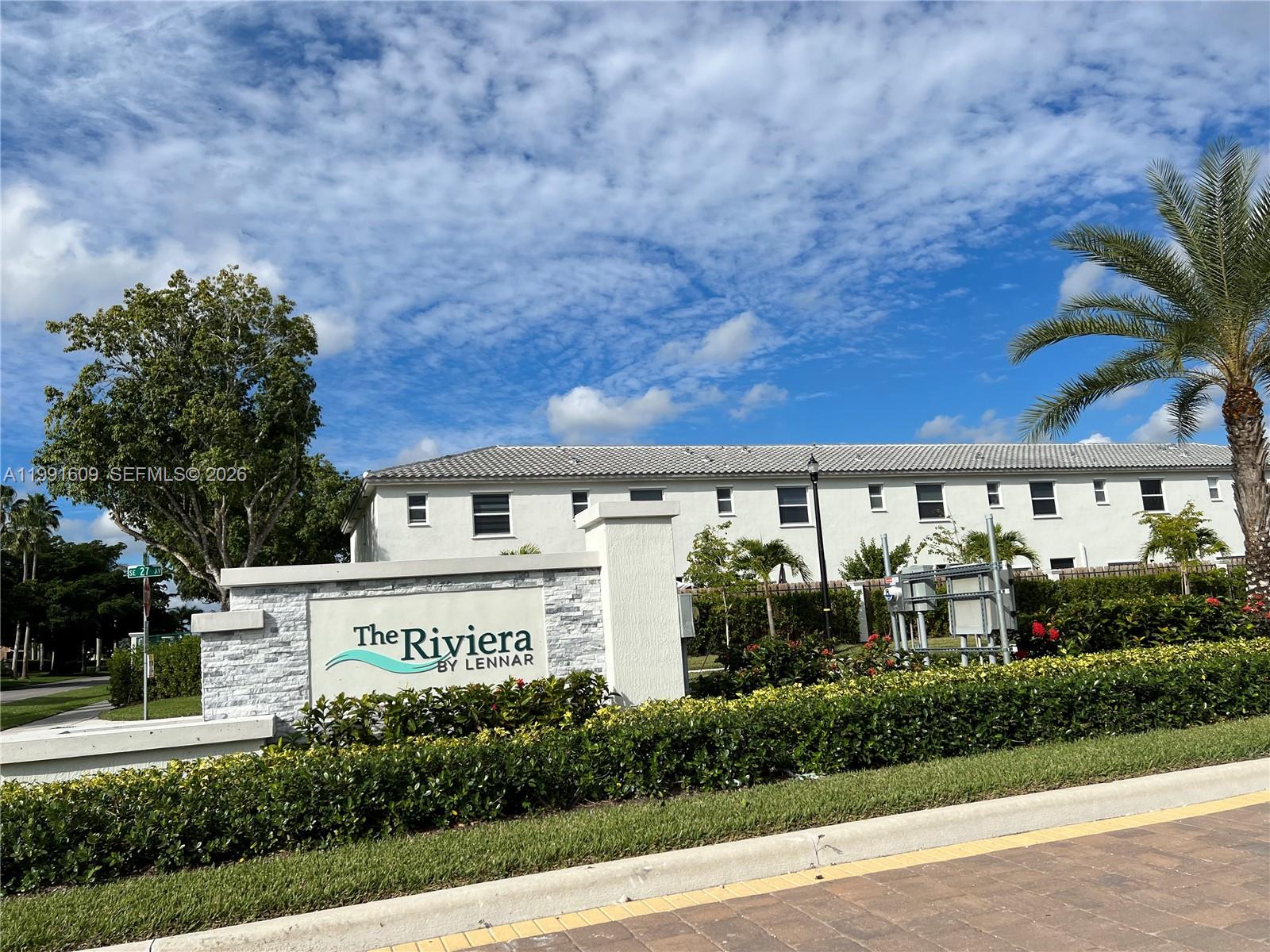 1864 Southeast 27th Street, Unit 1864 Homestead, FL 33035 - Photo 15 of 17 a view of a building with a garden