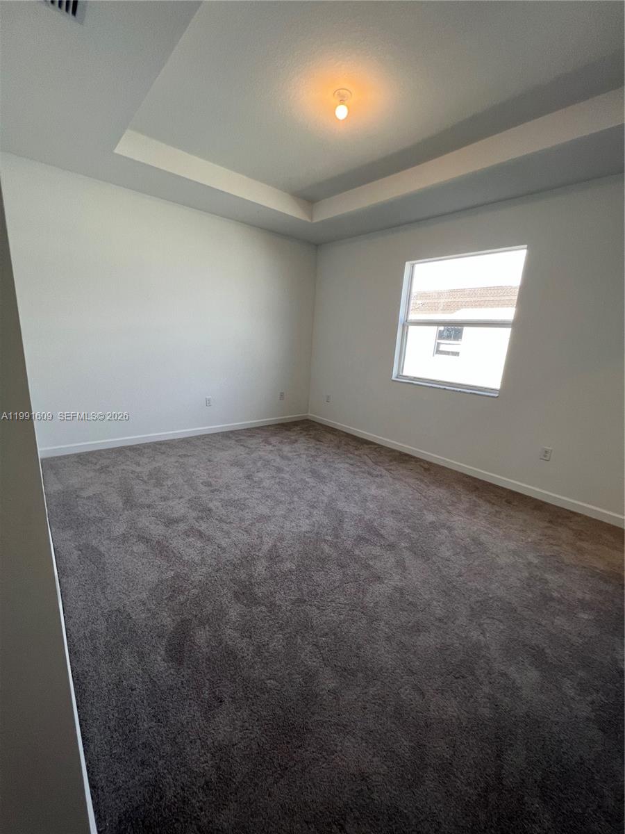 1864 Southeast 27th Street, Unit 1864 Homestead, FL 33035 - Photo 8 of 17 an empty room with a window