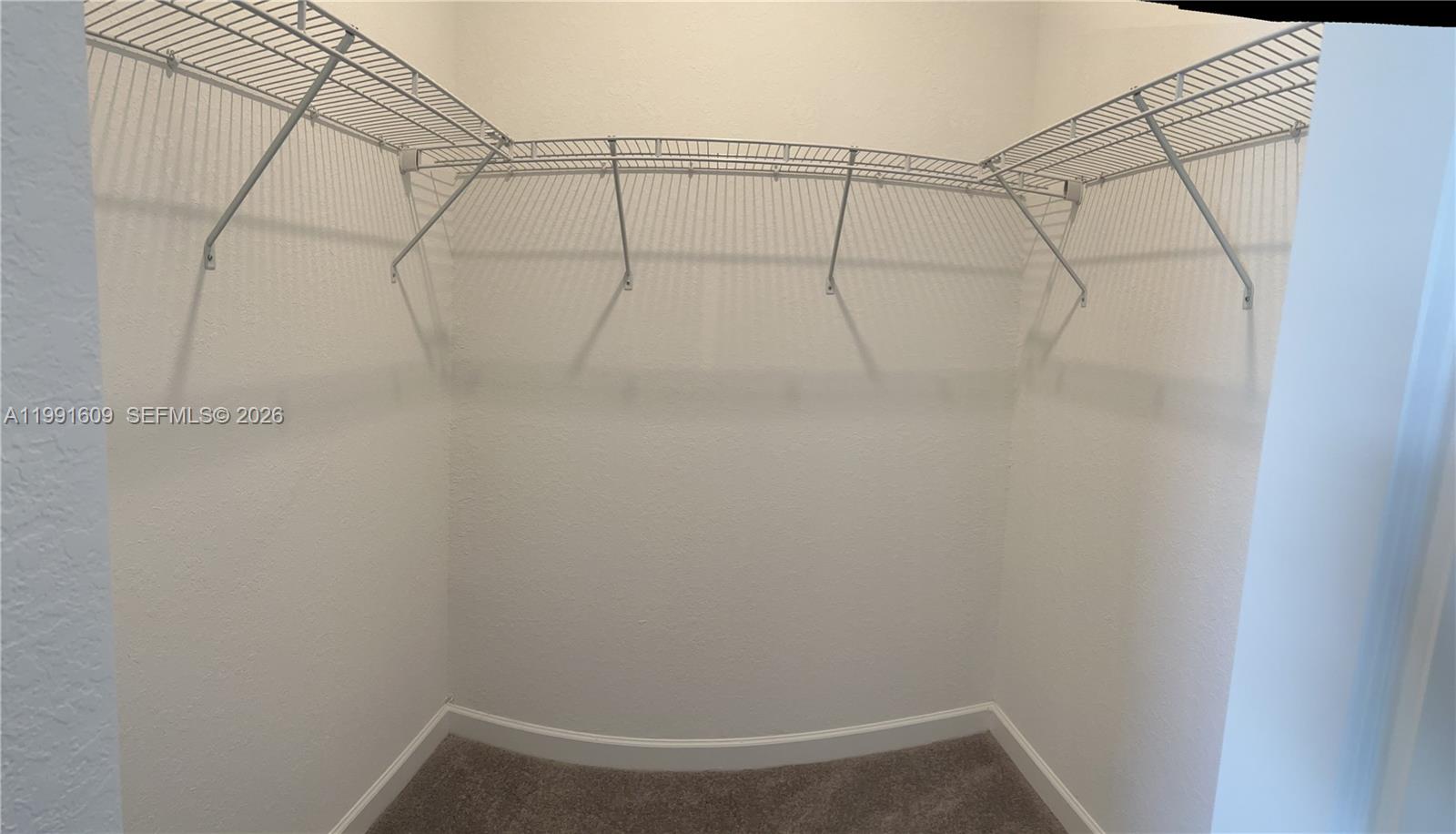 1864 Southeast 27th Street, Unit 1864 Homestead, FL 33035 - Photo 10 of 17 a view of a room with racks on the wall
