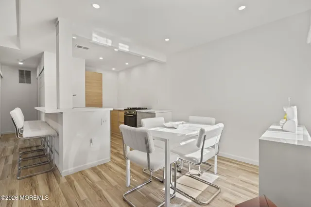 a dining room with a table and chairs