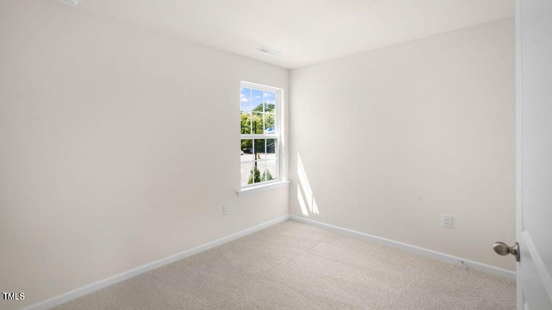 8517 Beckett Chase Way Raleigh, NC 27616 - Photo 28 of 31 an empty room with windows