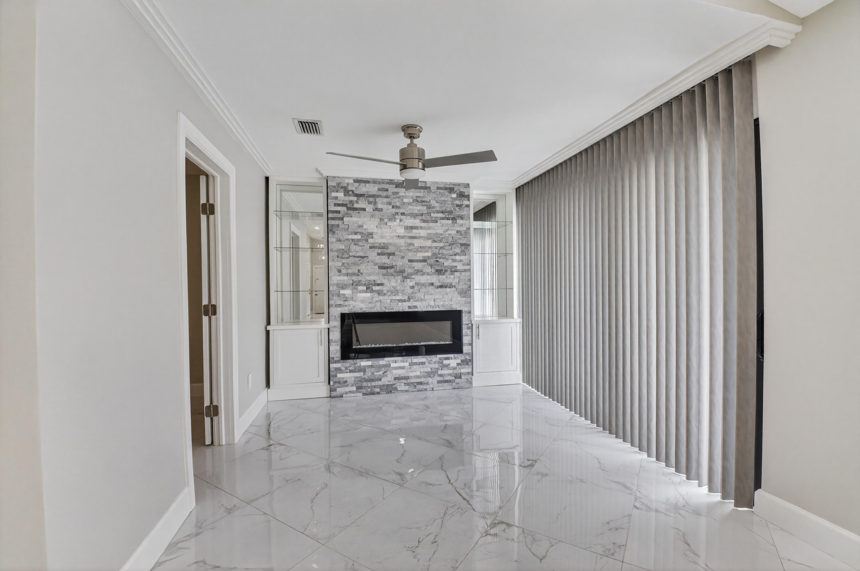 8216 Sweetbriar Way Boca Raton, FL 33496 - Photo 11 of 56 a view of a livingroom with a fireplace