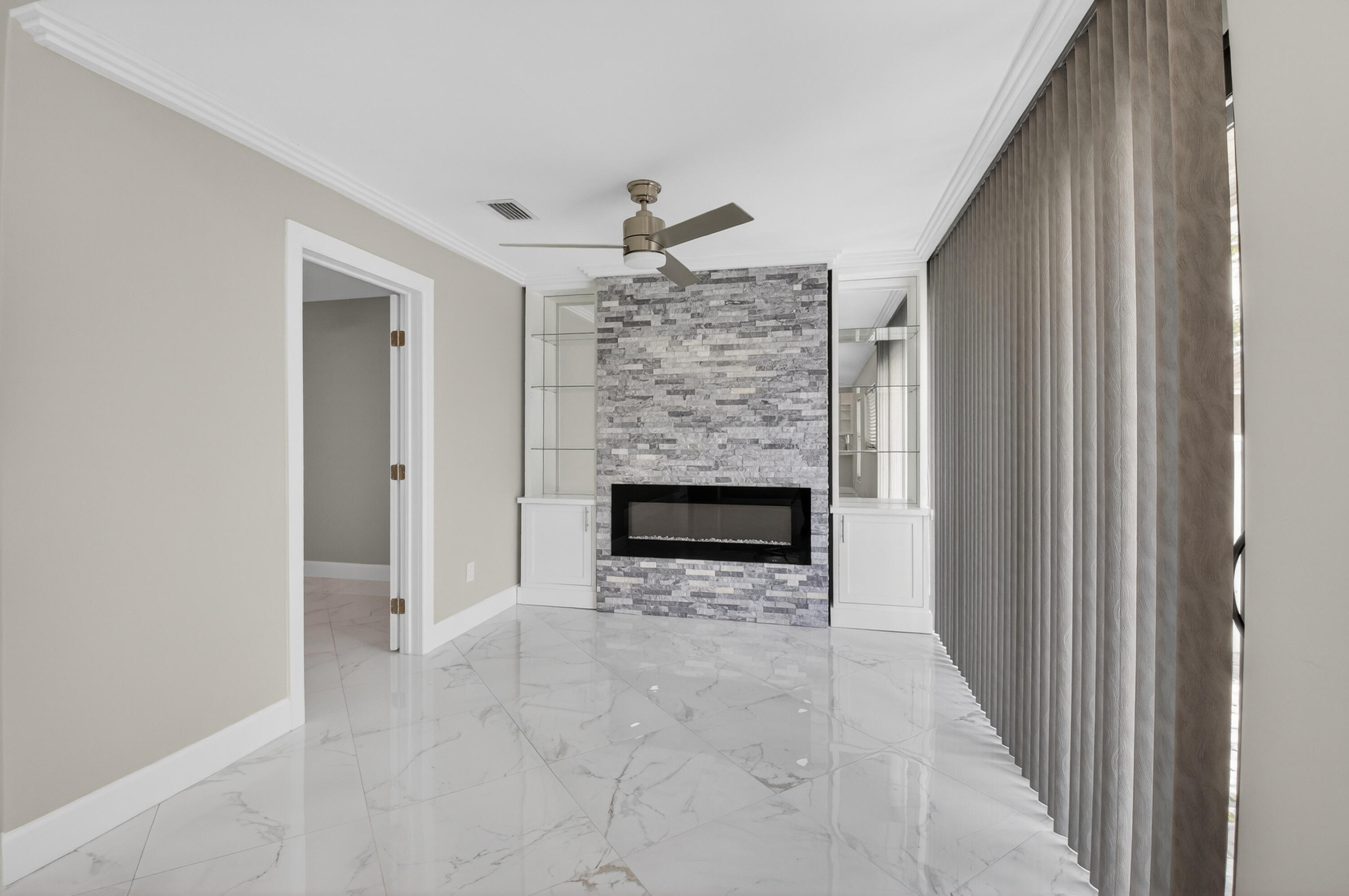 8216 Sweetbriar Way Boca Raton, FL 33496 - Photo 12 of 56 a view of a livingroom with a fireplace