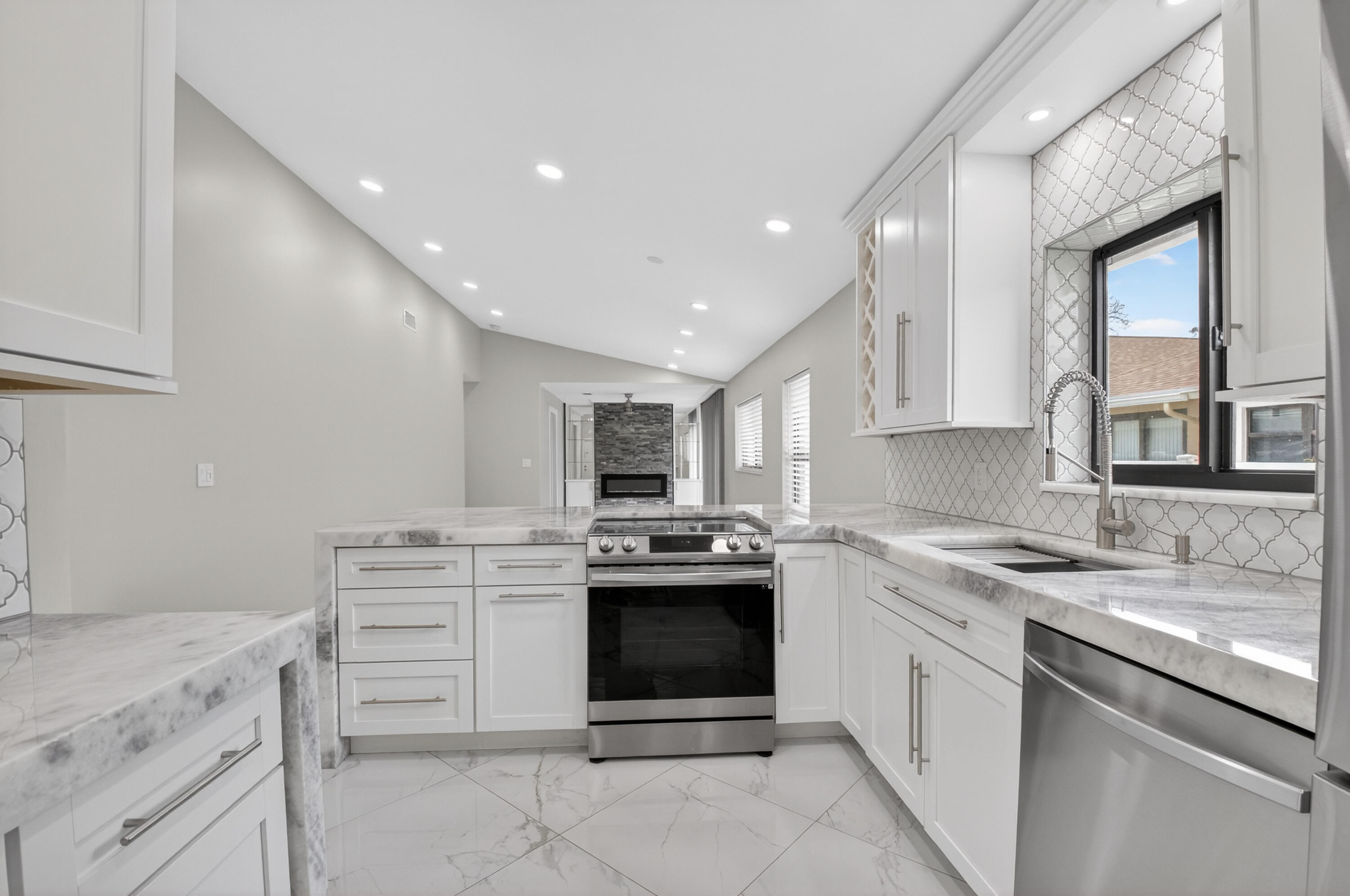 8216 Sweetbriar Way Boca Raton, FL 33496 - Photo 21 of 56 a kitchen with a stove sink and cabinets