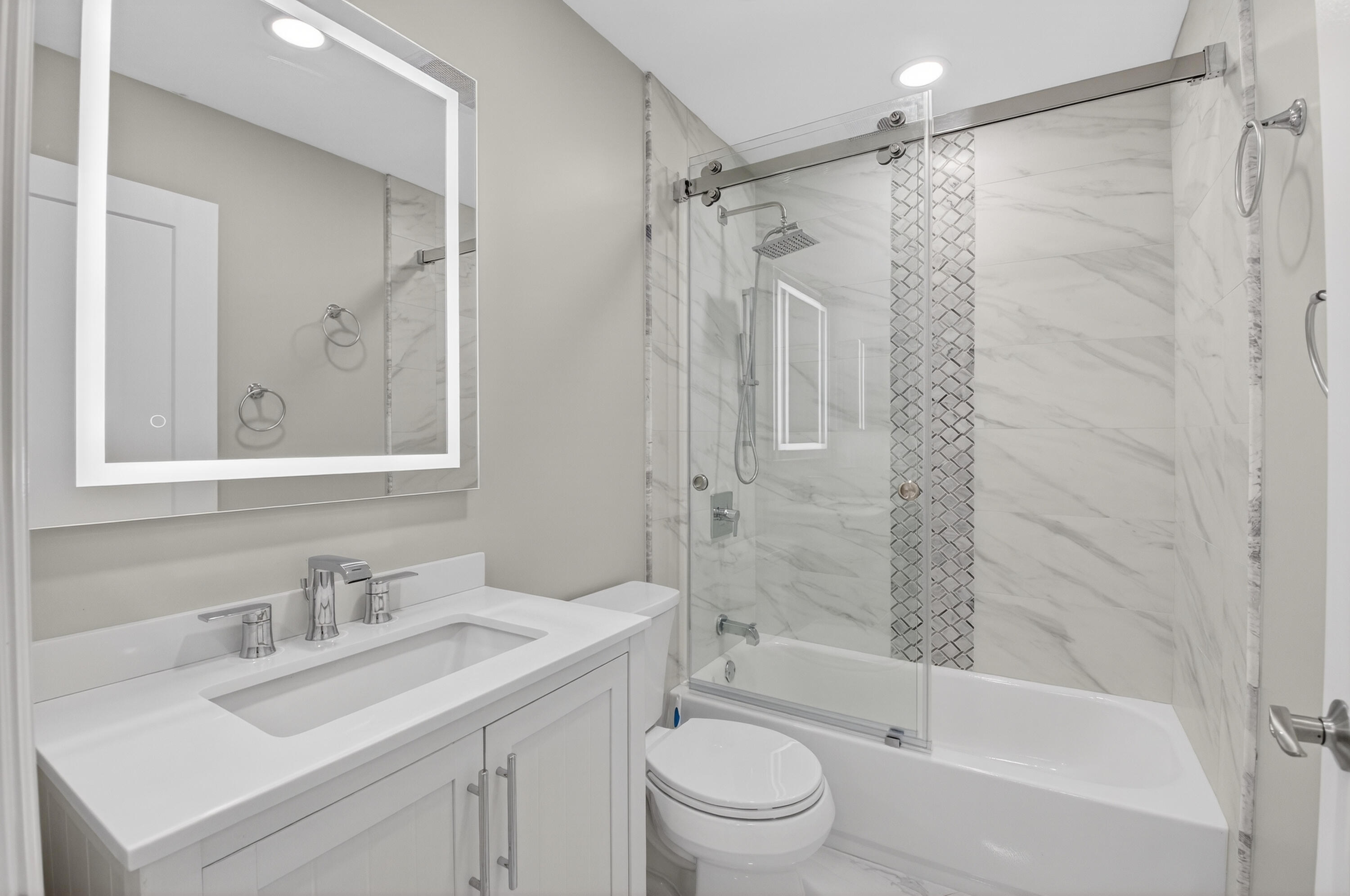 8216 Sweetbriar Way Boca Raton, FL 33496 - Photo 25 of 56 a bathroom with a sink toilet vanity and shower