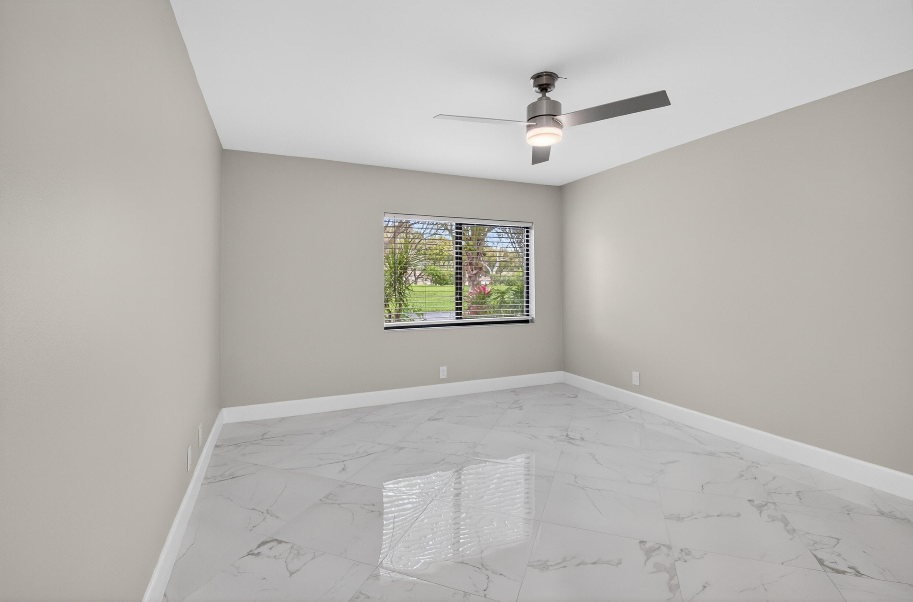 8216 Sweetbriar Way Boca Raton, FL 33496 - Photo 26 of 56 an empty room with windows and ceiling fan