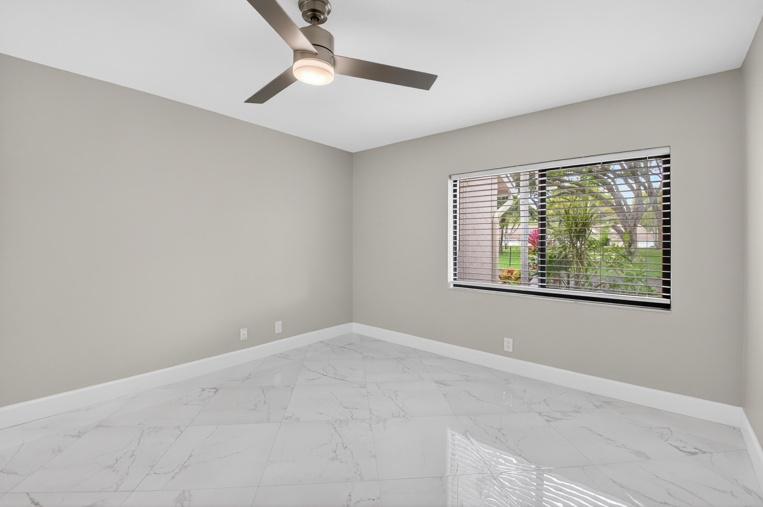 8216 Sweetbriar Way Boca Raton, FL 33496 - Photo 27 of 56 an empty room with windows