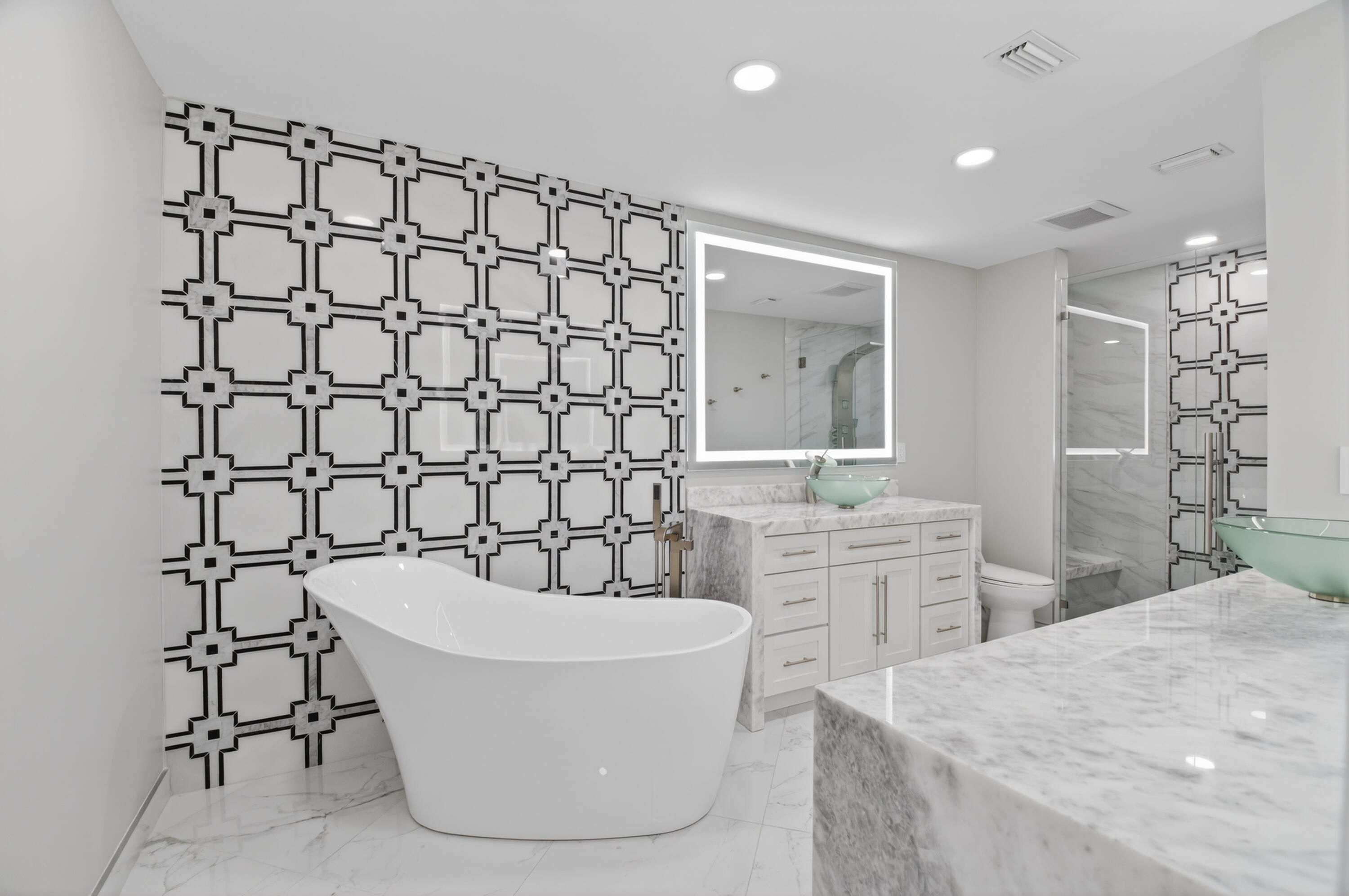 8216 Sweetbriar Way Boca Raton, FL 33496 - Photo 30 of 56 a bathroom with a bathtub sink and mirror