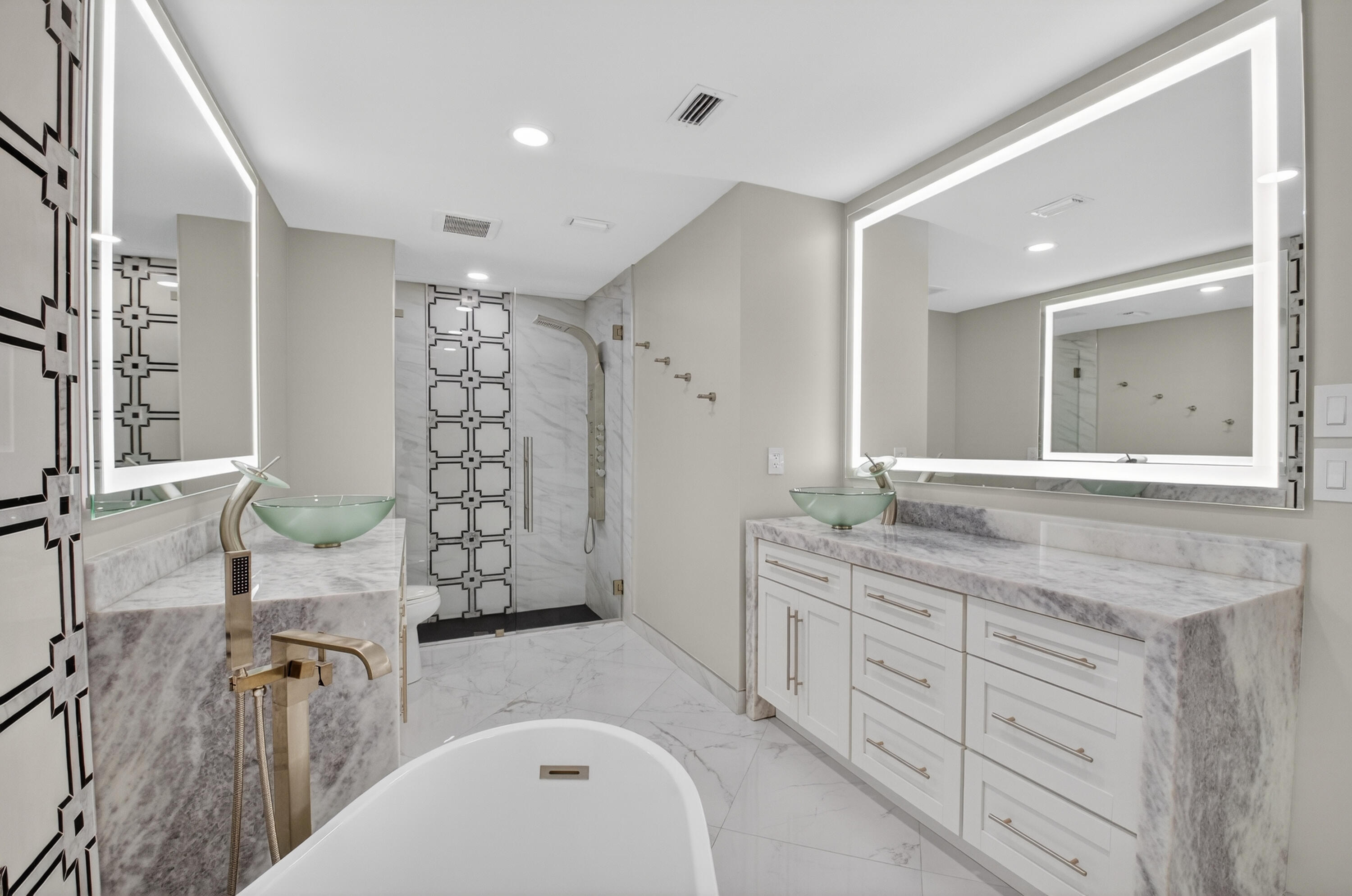 8216 Sweetbriar Way Boca Raton, FL 33496 - Photo 32 of 56 a bathroom with a granite countertop sink a toilet a mirror a vanity and shower