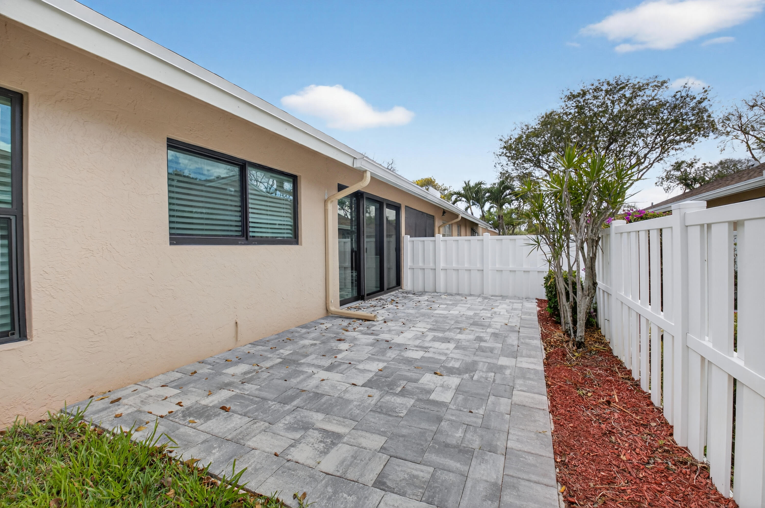 8216 Sweetbriar Way Boca Raton, FL 33496 - Photo 35 of 56 a front view of a house with a yard