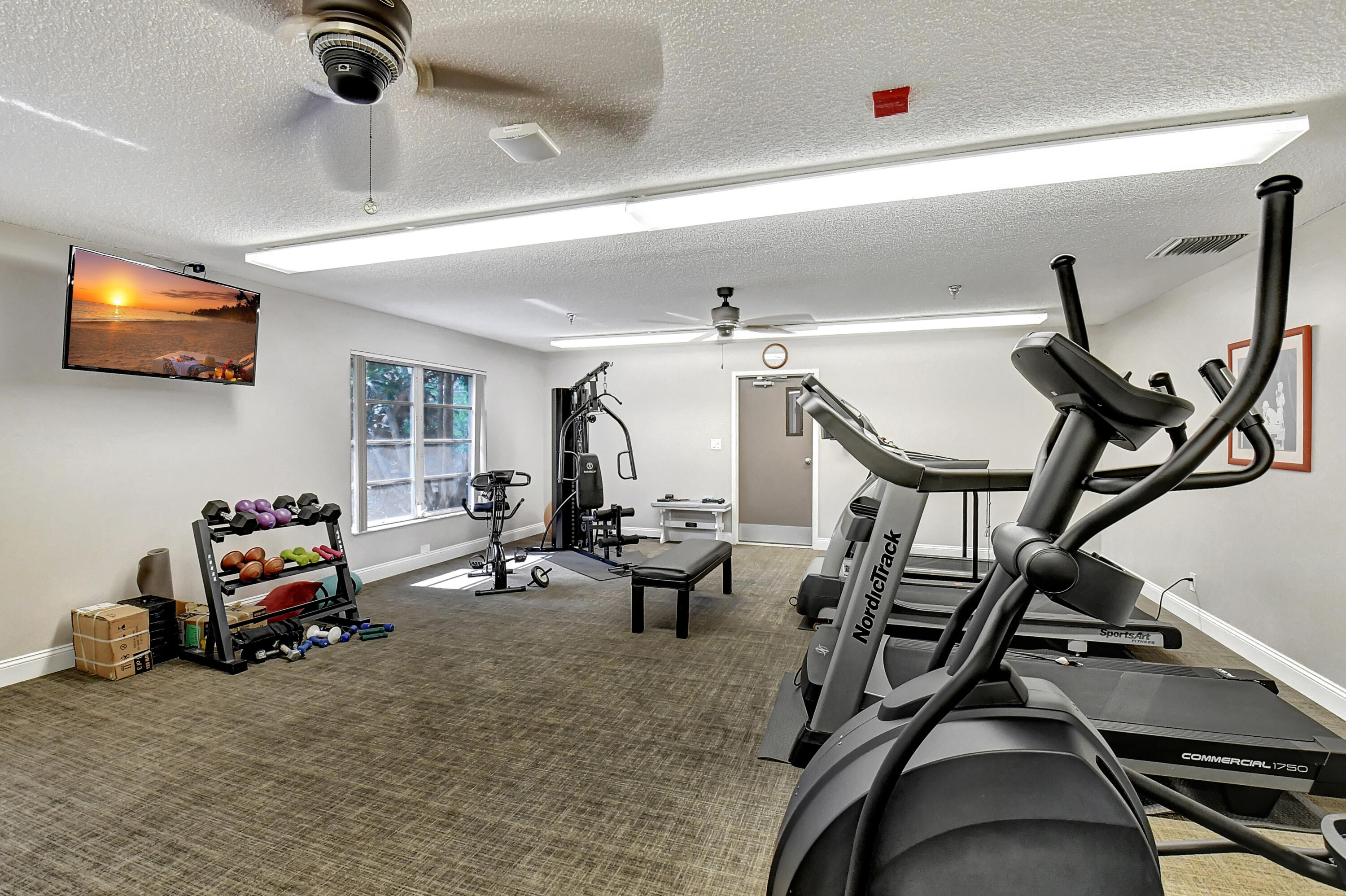 8216 Sweetbriar Way Boca Raton, FL 33496 - Photo 41 of 56 a view of a room with gym equipment