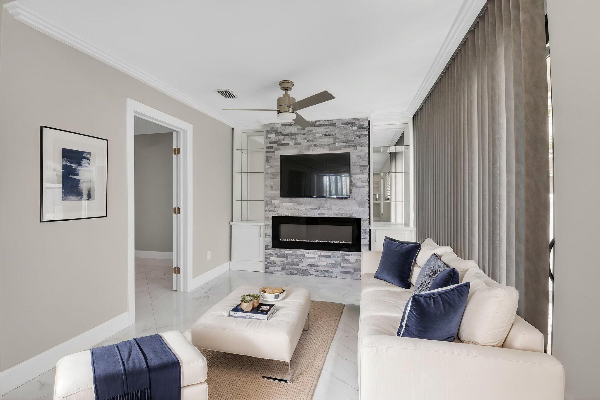 8216 Sweetbriar Way Boca Raton, FL 33496 - Photo 54 of 56 a living room with furniture and a fireplace