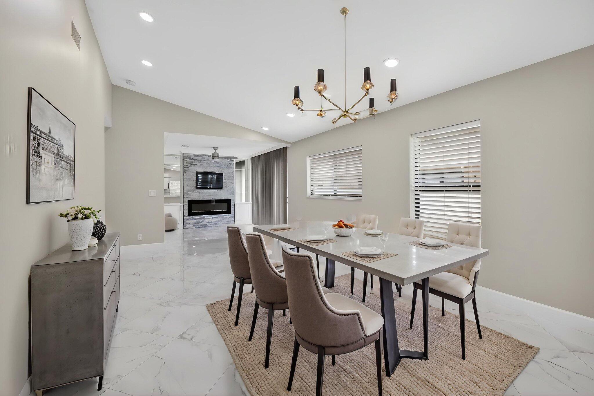 8216 Sweetbriar Way Boca Raton, FL 33496 - Photo 56 of 56 a view of a dining room with furniture and wooden floor
