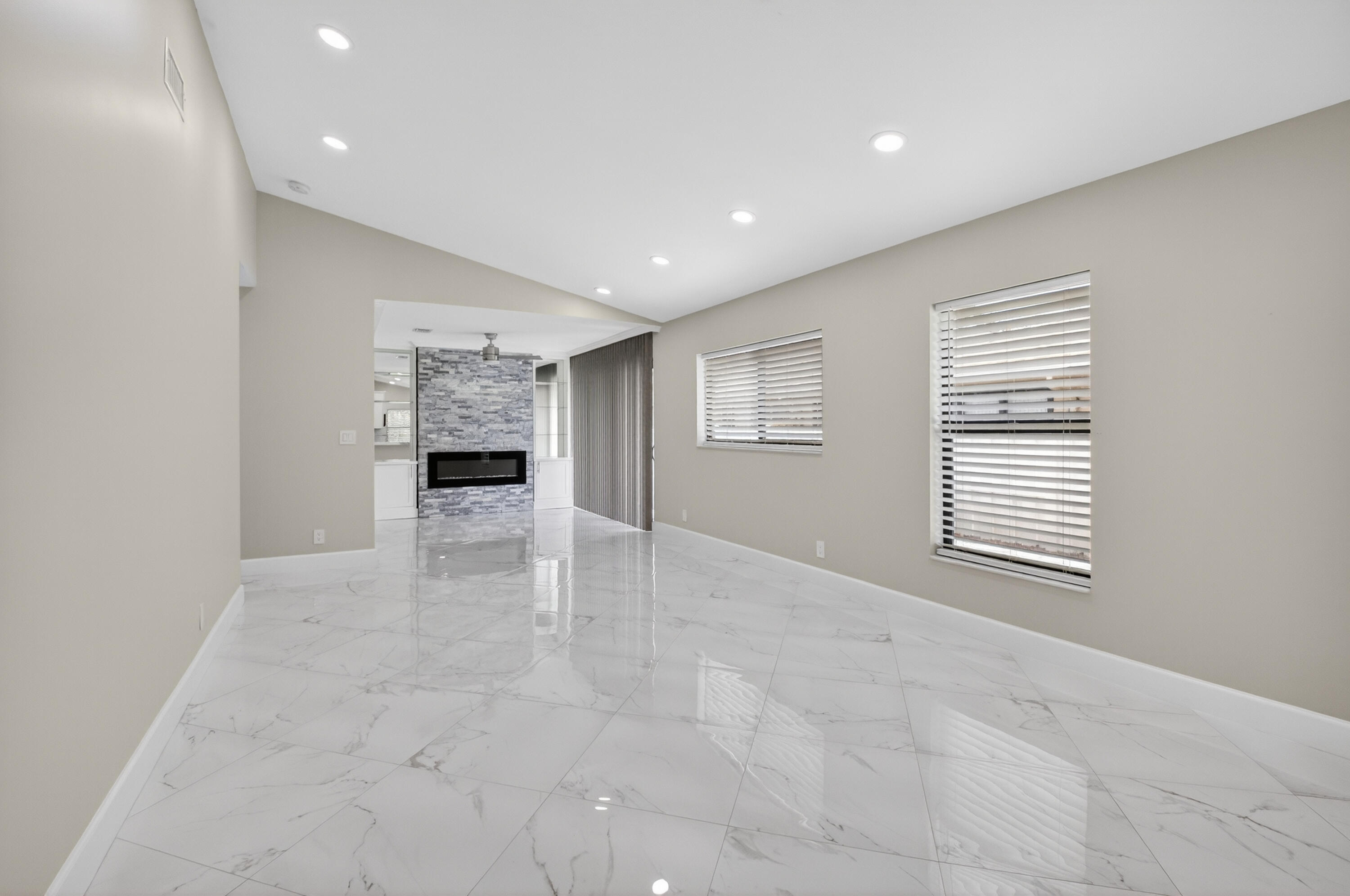 8216 Sweetbriar Way Boca Raton, FL 33496 - Photo 7 of 56 a view of an empty room with a window