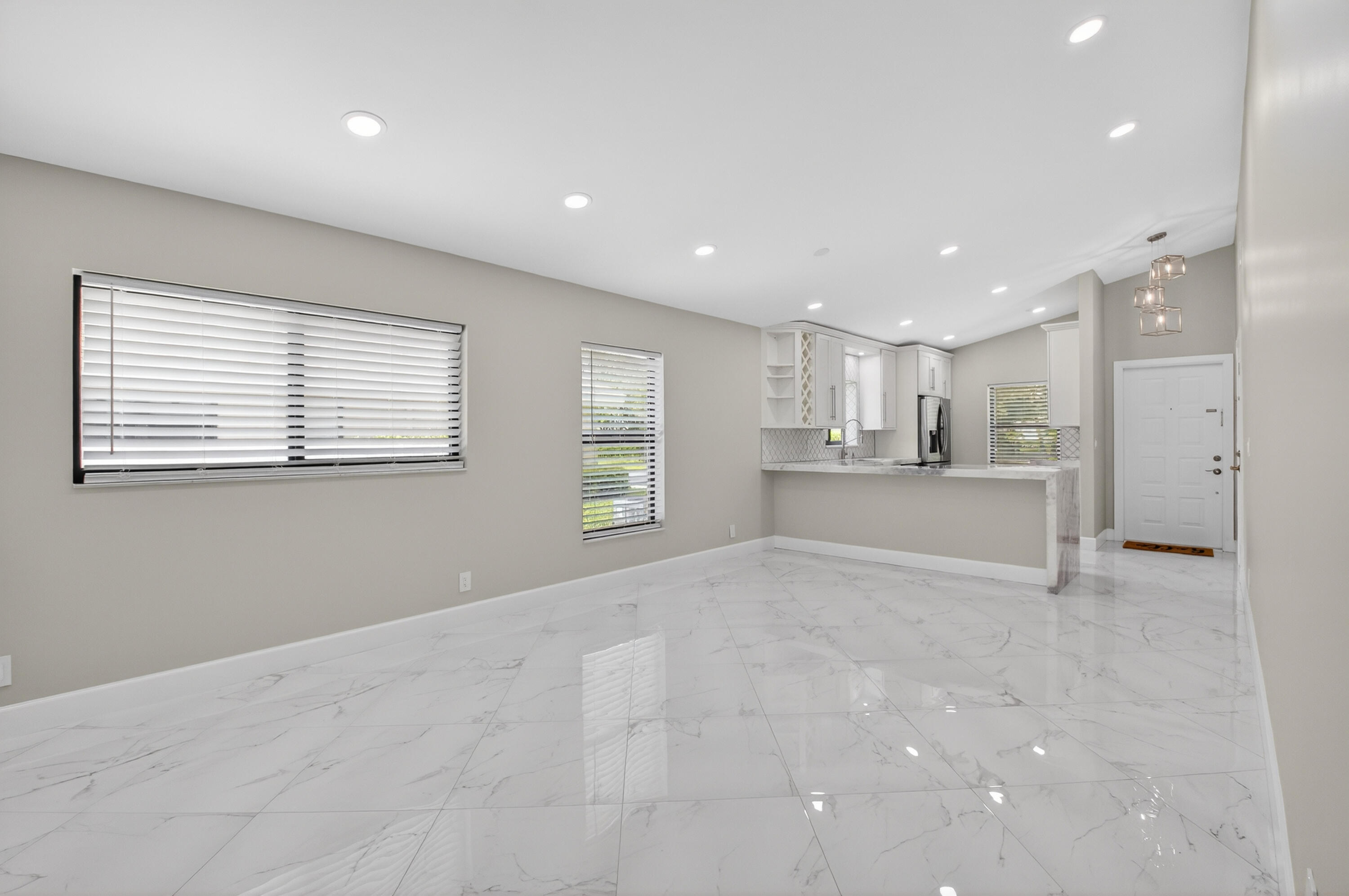 8216 Sweetbriar Way Boca Raton, FL 33496 - Photo 9 of 56 a view of a kitchen with a sink and cabinets