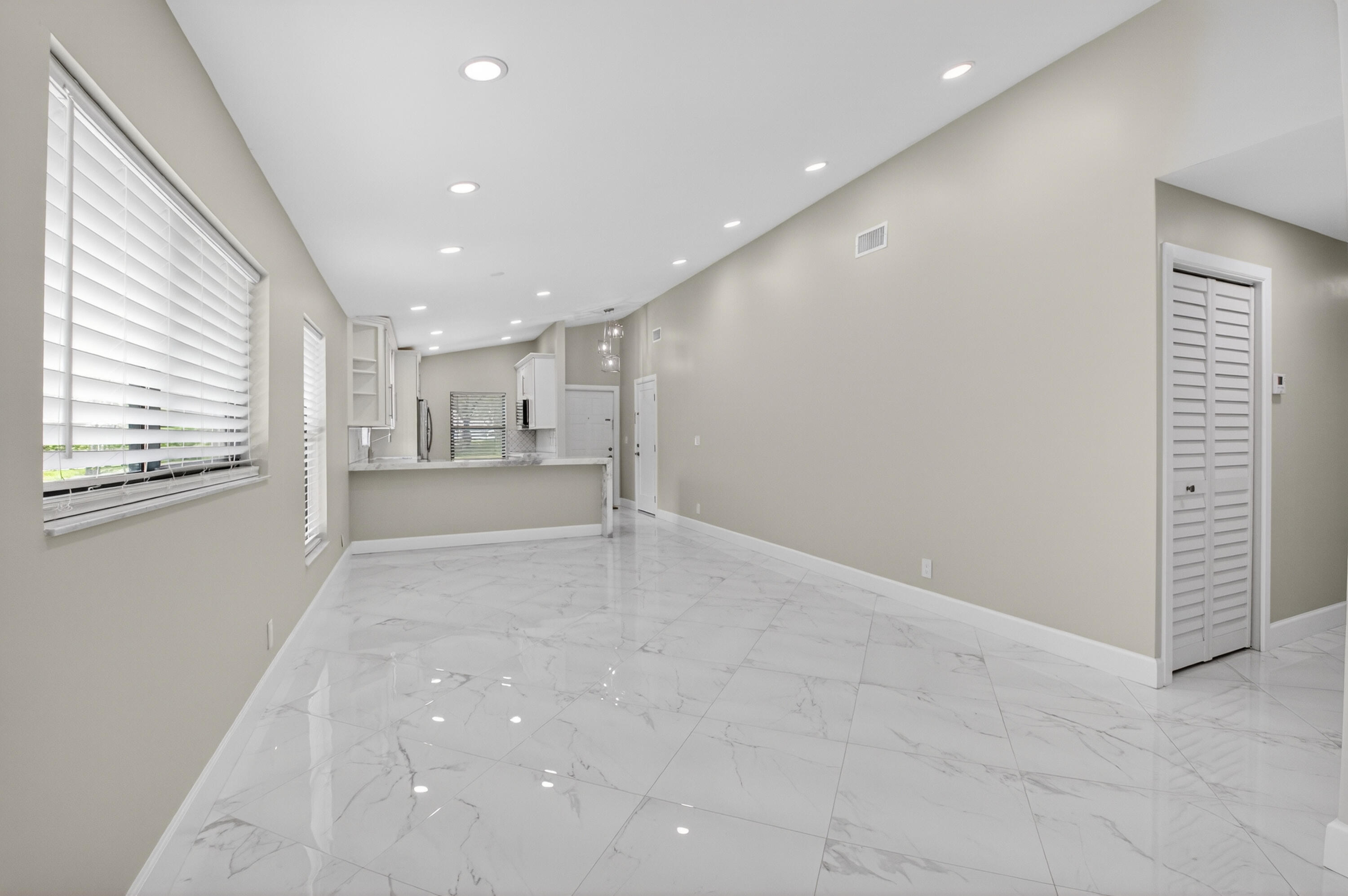 8216 Sweetbriar Way Boca Raton, FL 33496 - Photo 10 of 56 a view of a kitchen with a refrigerator and a window