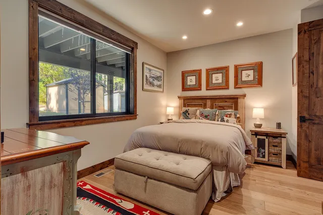 a bedroom with a bed and a window