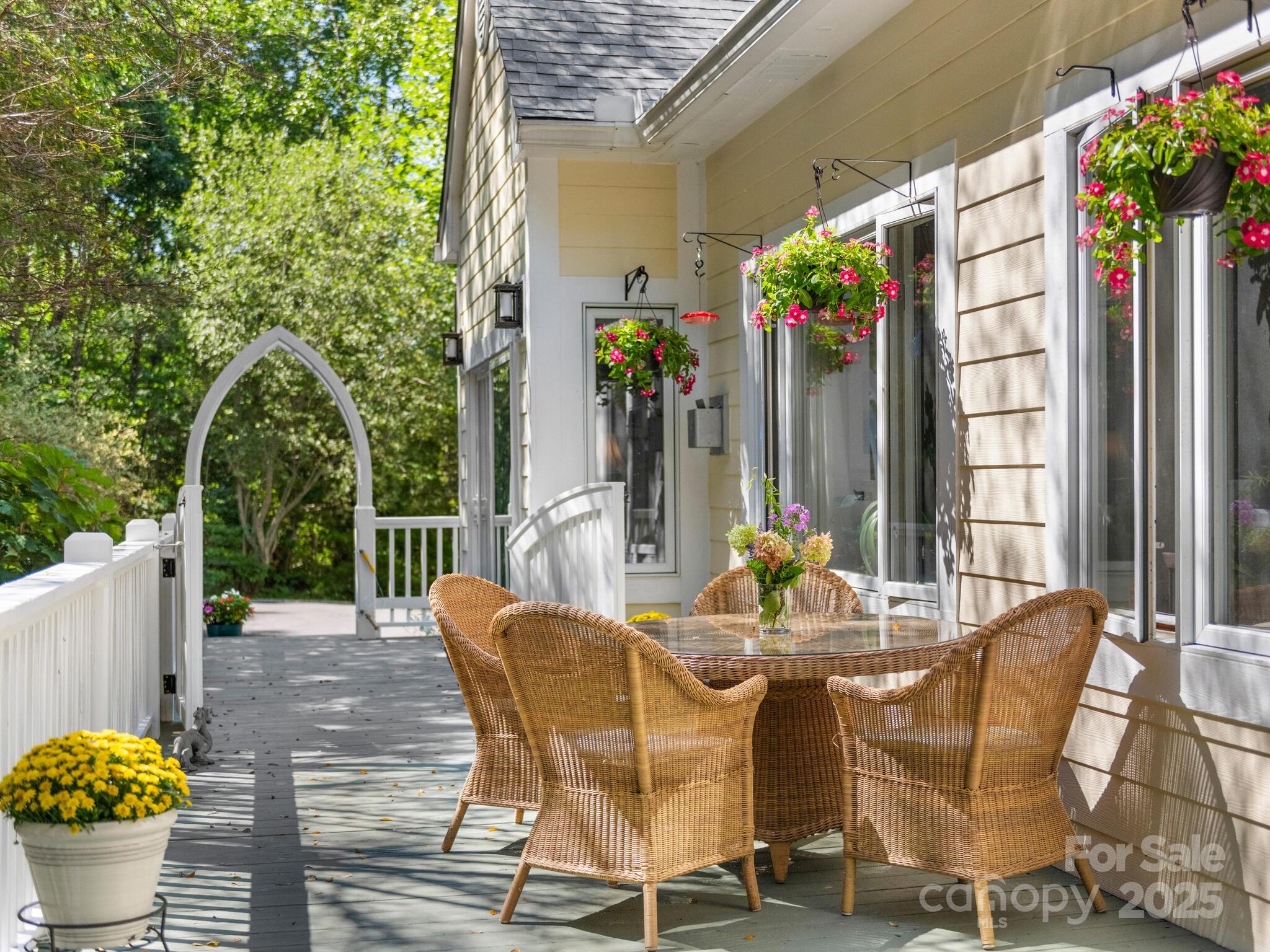 80 Ivy Cove Road Fairview, NC 28730 - Photo 11 of 48 a view of a patio with table and chairs and potted plants