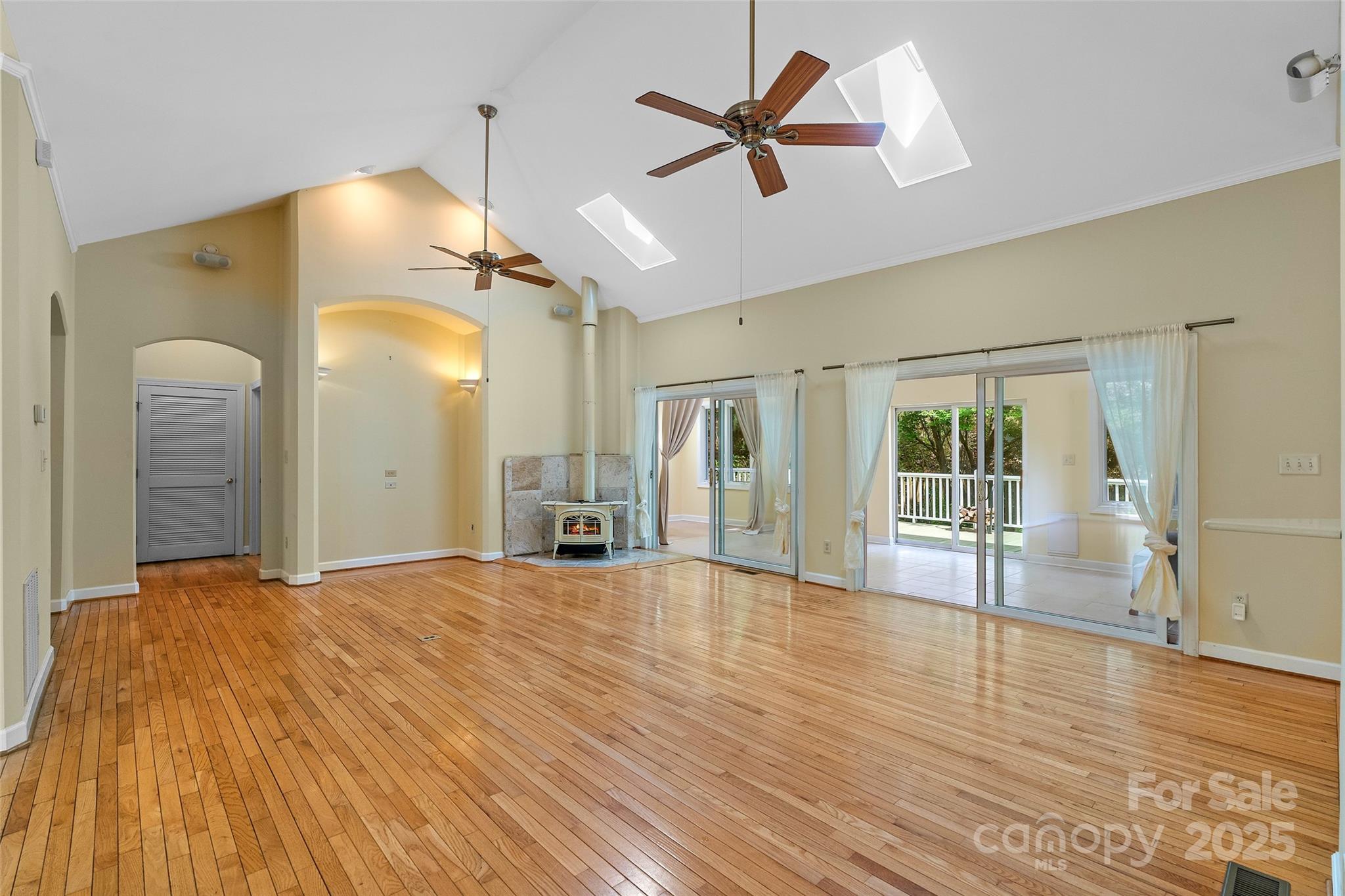 80 Ivy Cove Road Fairview, NC 28730 - Photo 16 of 48 a big room with wooden floor and windows