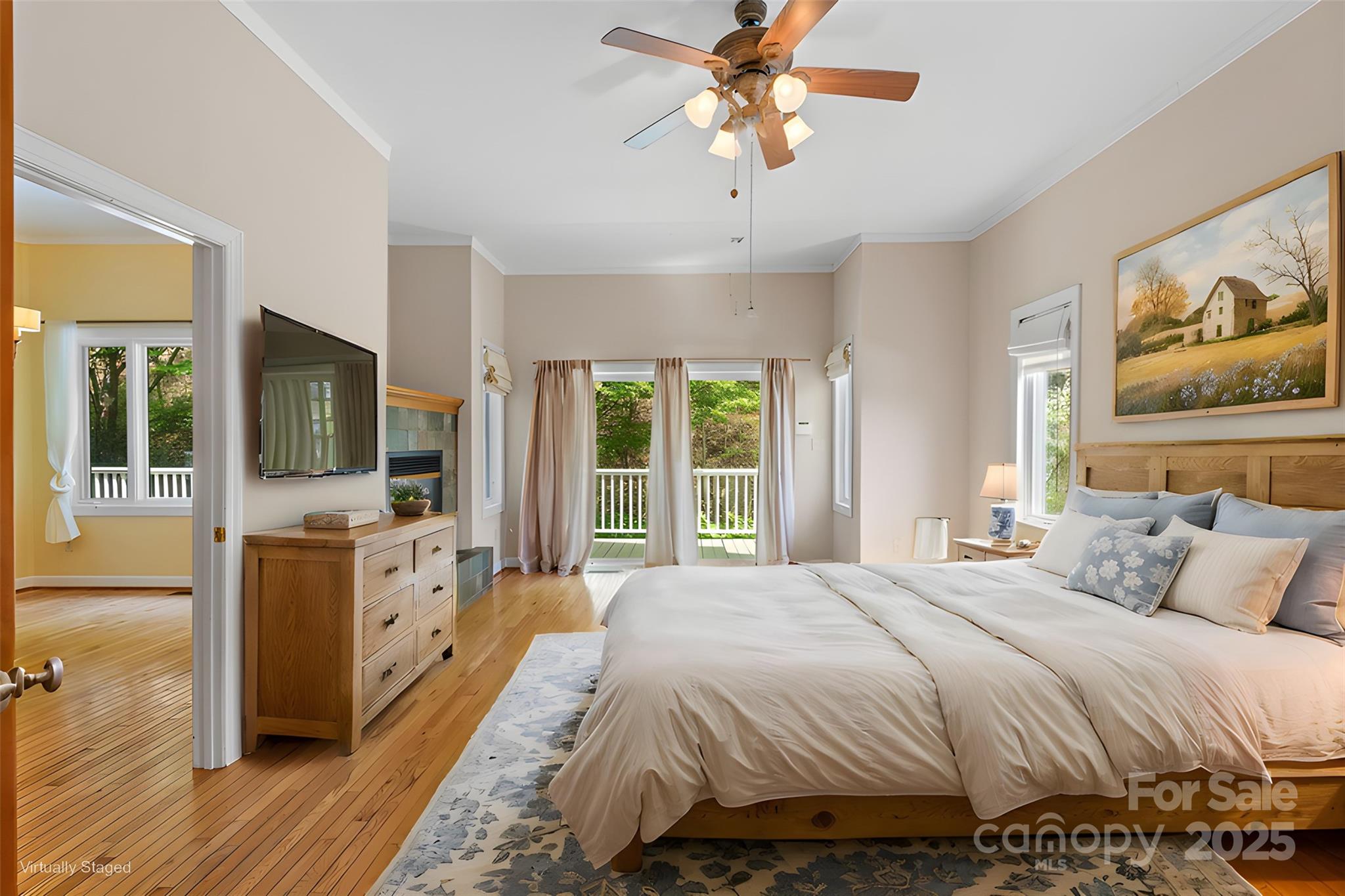 80 Ivy Cove Road Fairview, NC 28730 - Photo 29 of 48 a bedroom with a bed and a flat screen tv