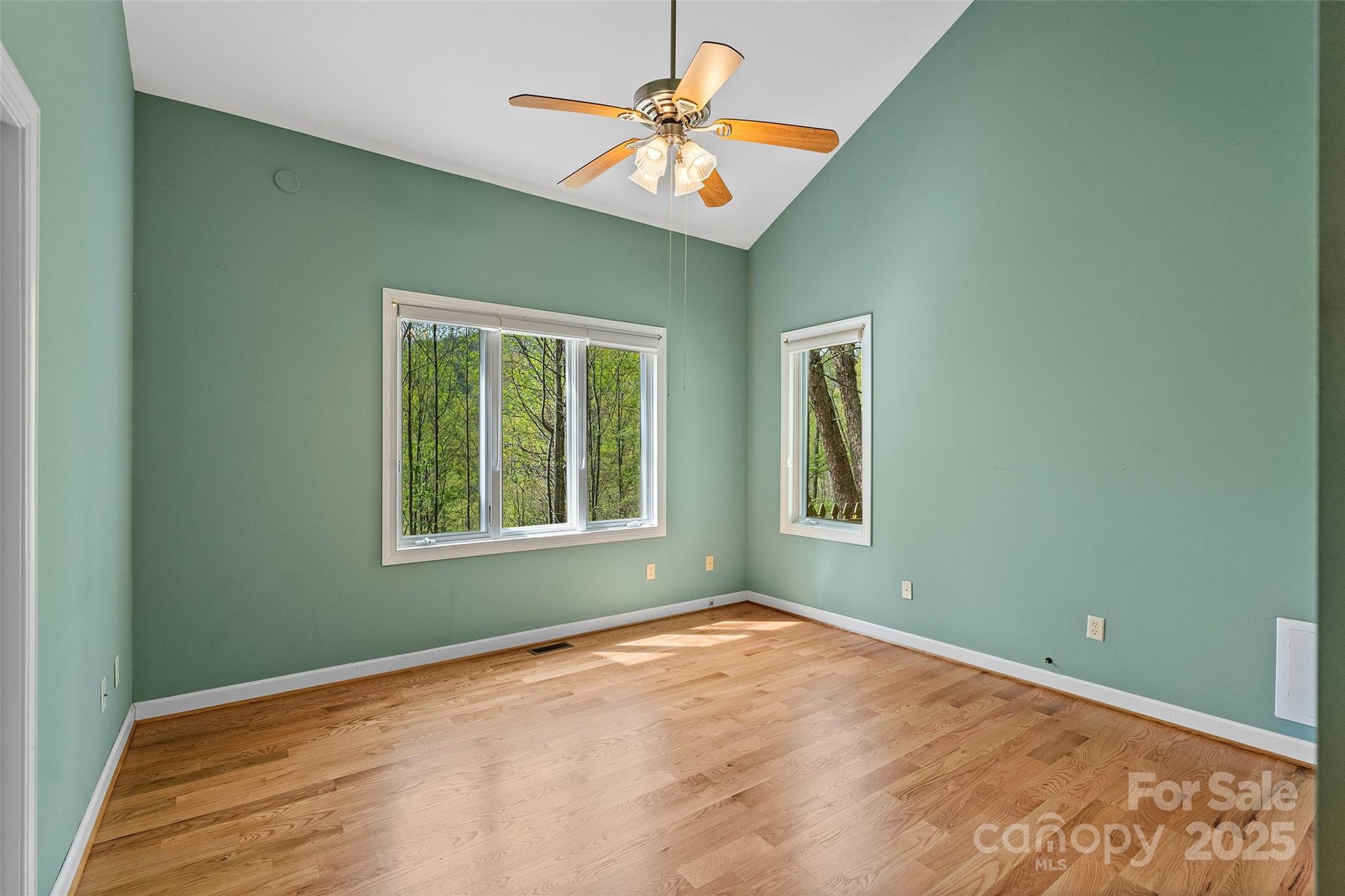 80 Ivy Cove Road Fairview, NC 28730 - Photo 40 of 48 a view of a room with a window and a ceiling fan