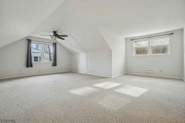 a view of a big room with windows