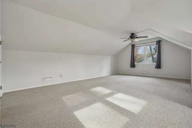 an empty room with a empty space and windows