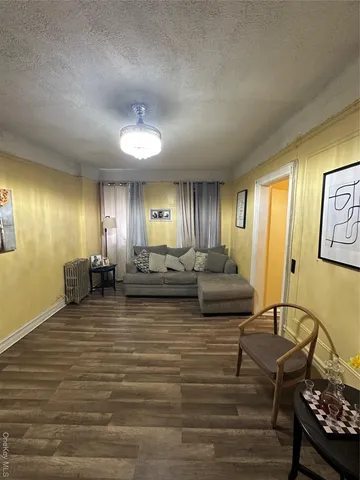 a living room with fireplace furniture and a window