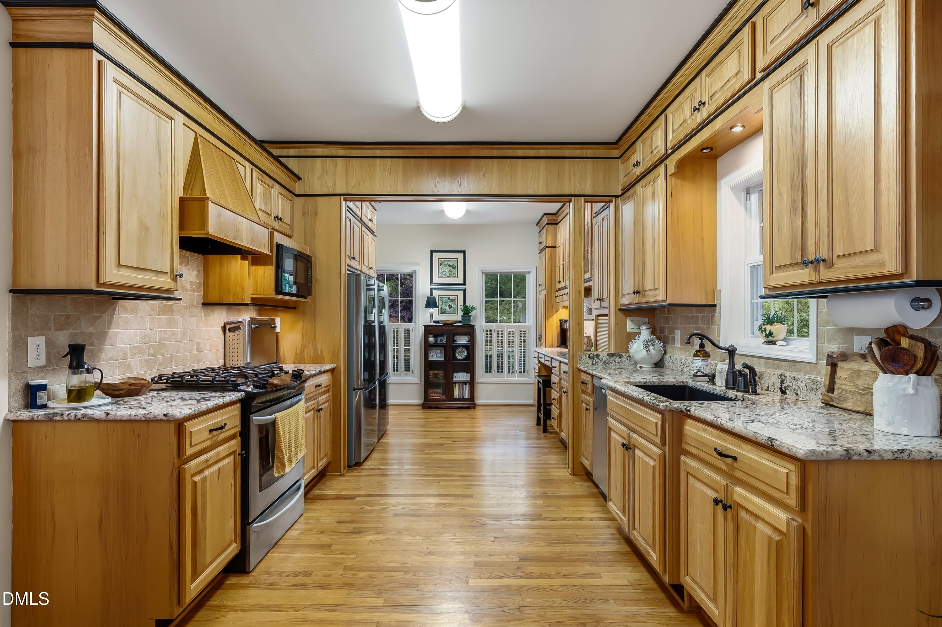 1214 Halcyon Place Rougemont, NC 27572 - Photo 27 of 69 a kitchen with stainless steel appliances granite countertop a stove and cabinets