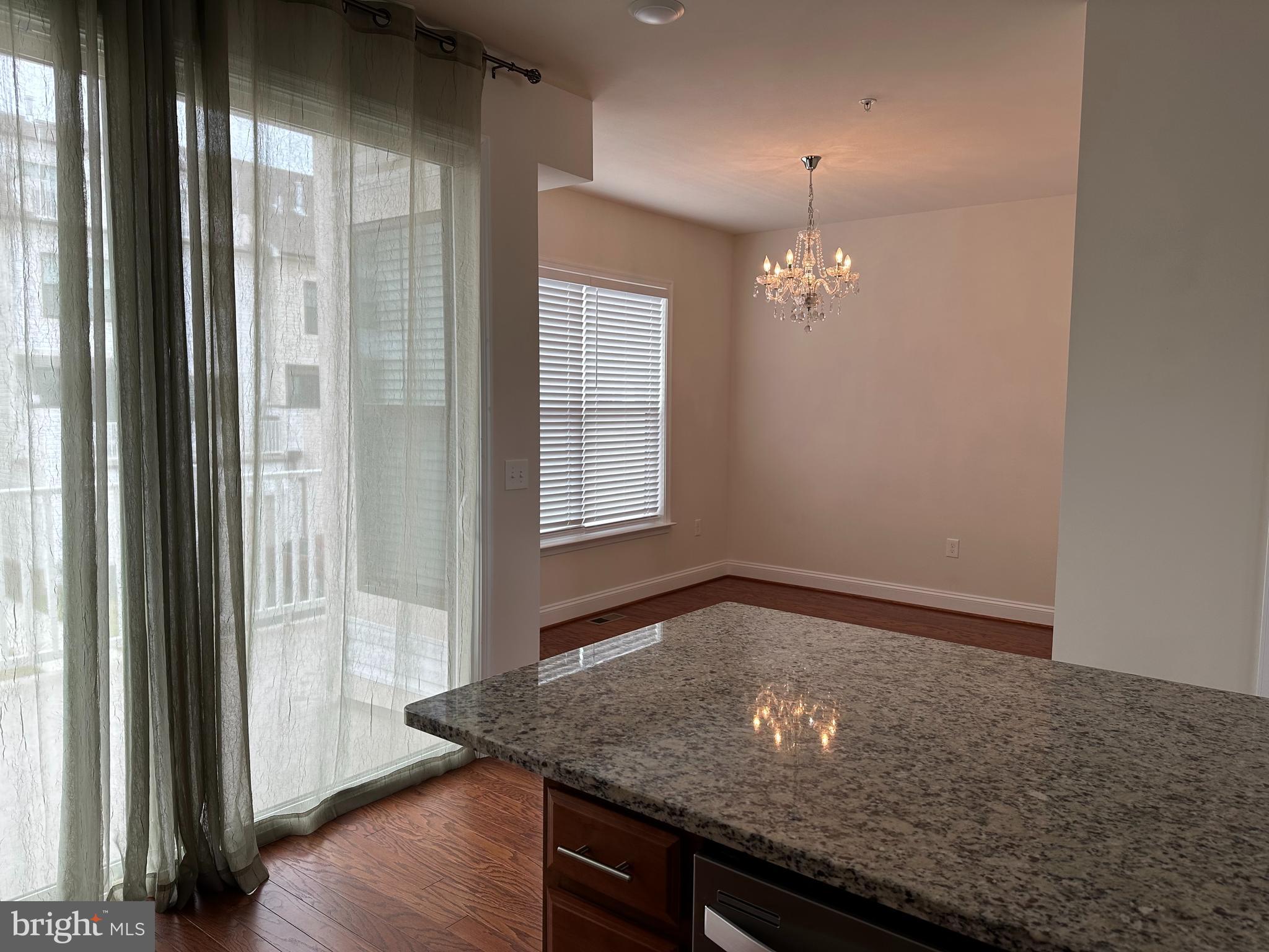 22591 Amendola Terrace Ashburn, VA 20148 - Photo 12 of 39 a view of a room with window and wooden floor