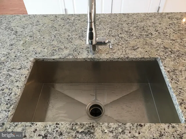 a bathroom with a sink toilet tub and shower