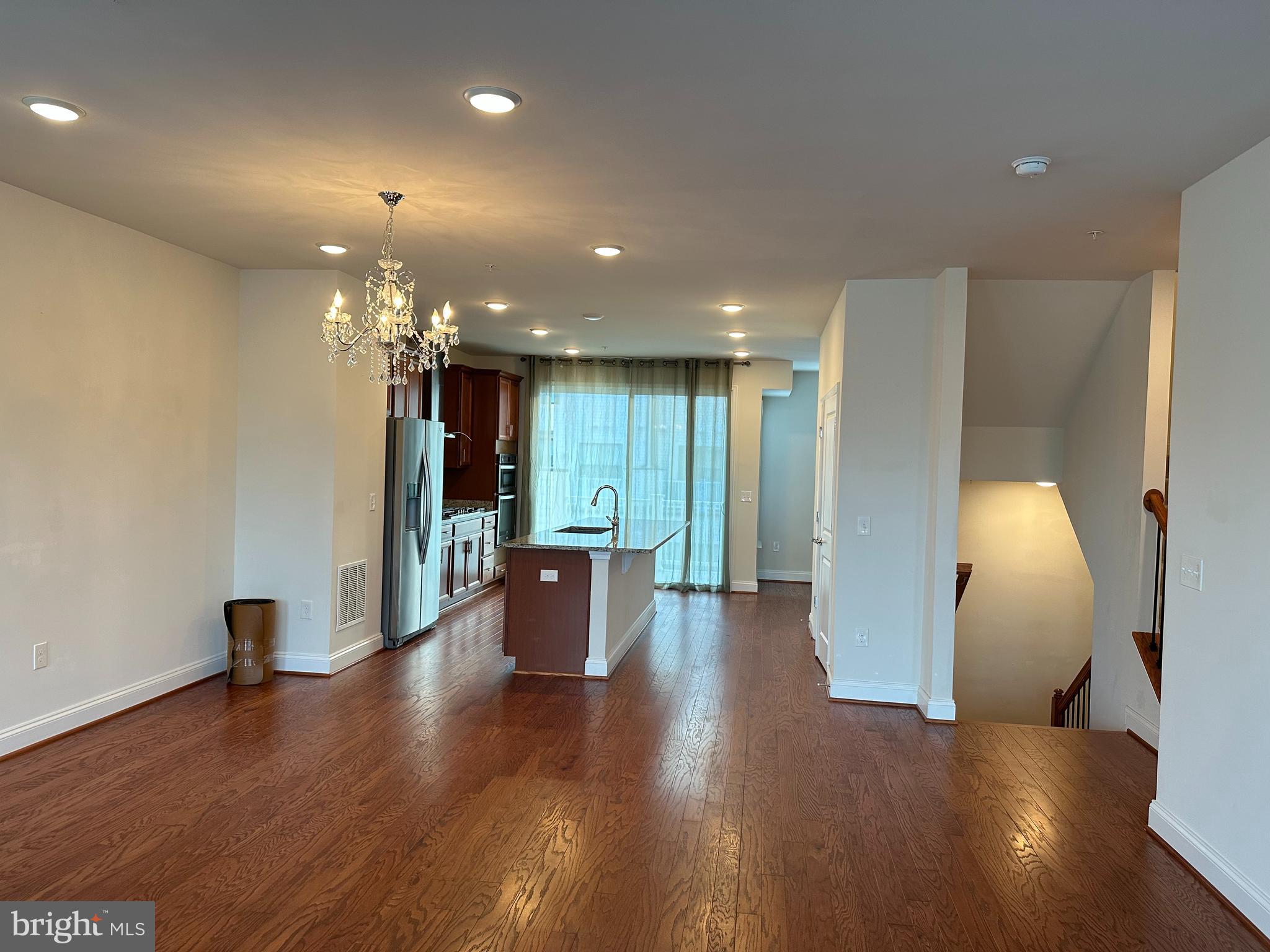 22591 Amendola Terrace Ashburn, VA 20148 - Photo 9 of 39 a view of a big room with wooden floor and windows