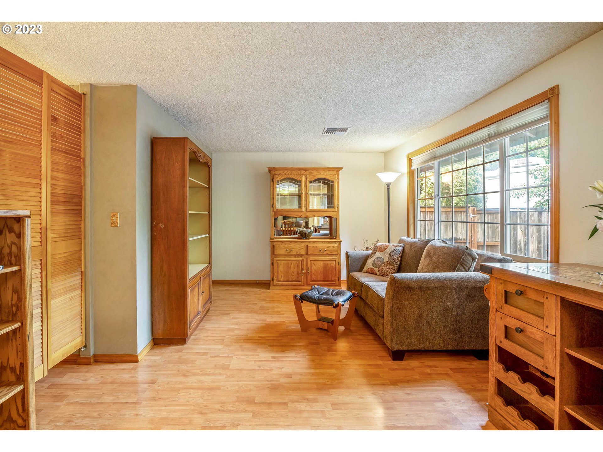 2565 Windsor Circle East Eugene, OR 97405 - Photo 9 of 38 a living room with furniture and a flat screen tv