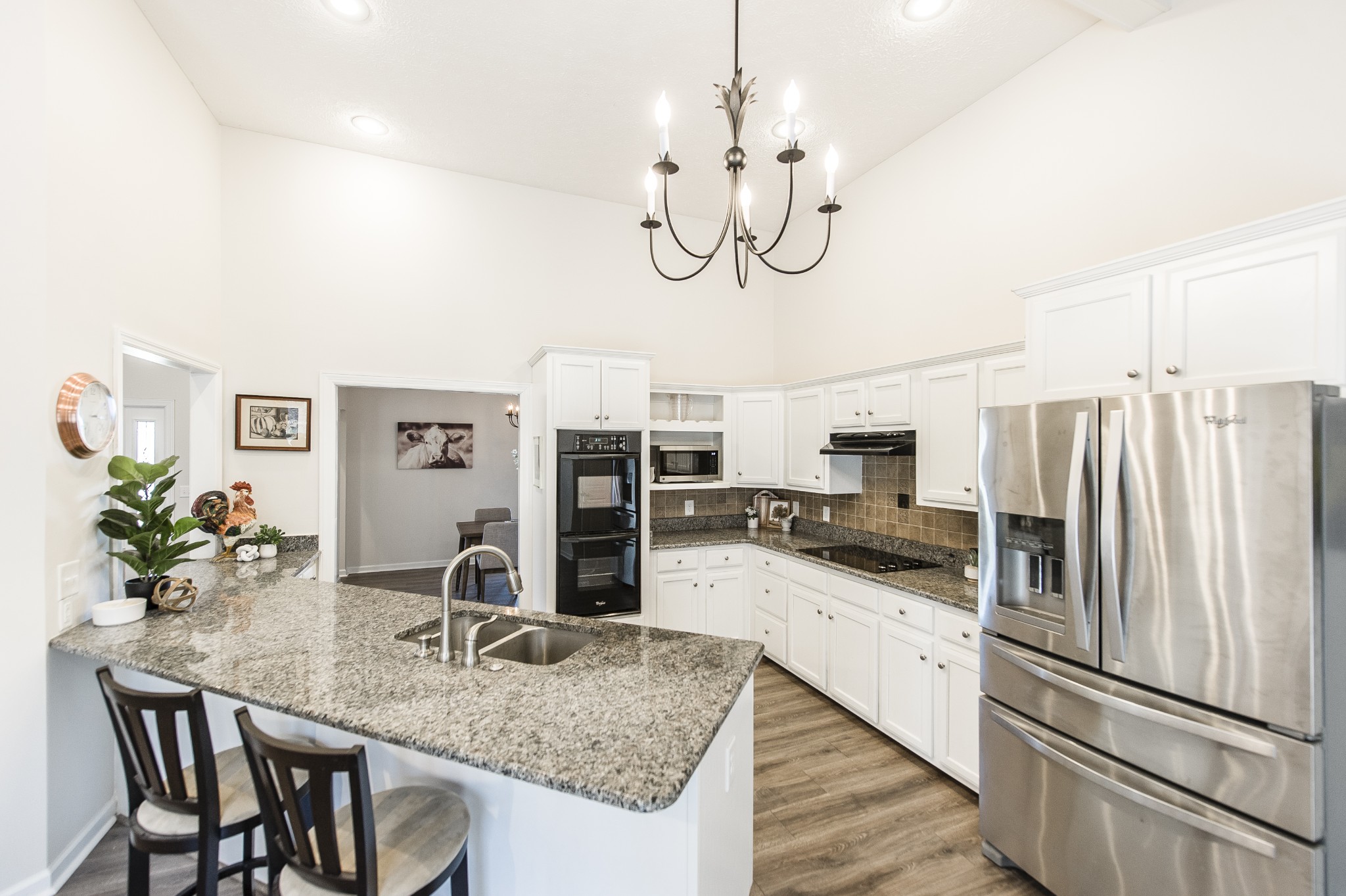 4305 Franklin Road Lebanon, TN 37090 - Photo 16 of 67 a kitchen with stainless steel appliances granite countertop a sink a stove a oven a dining table and chairs