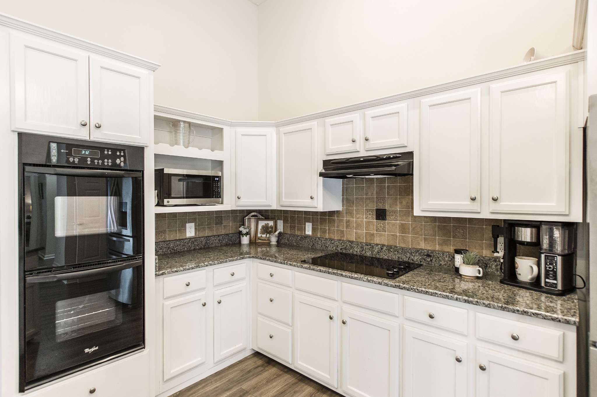 4305 Franklin Road Lebanon, TN 37090 - Photo 17 of 67 a kitchen with granite countertop white cabinets and stainless steel appliances