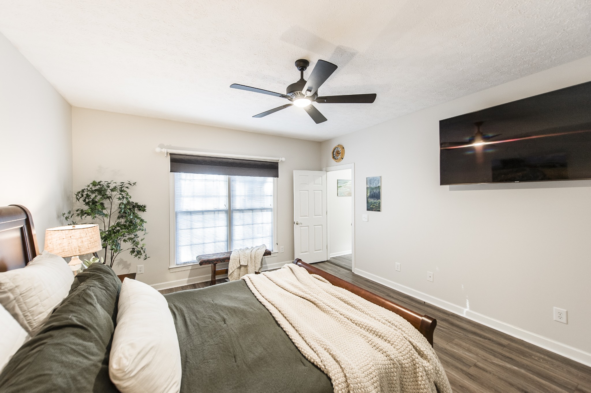 4305 Franklin Road Lebanon, TN 37090 - Photo 22 of 67 a spacious bedroom with a bed and a flat screen tv