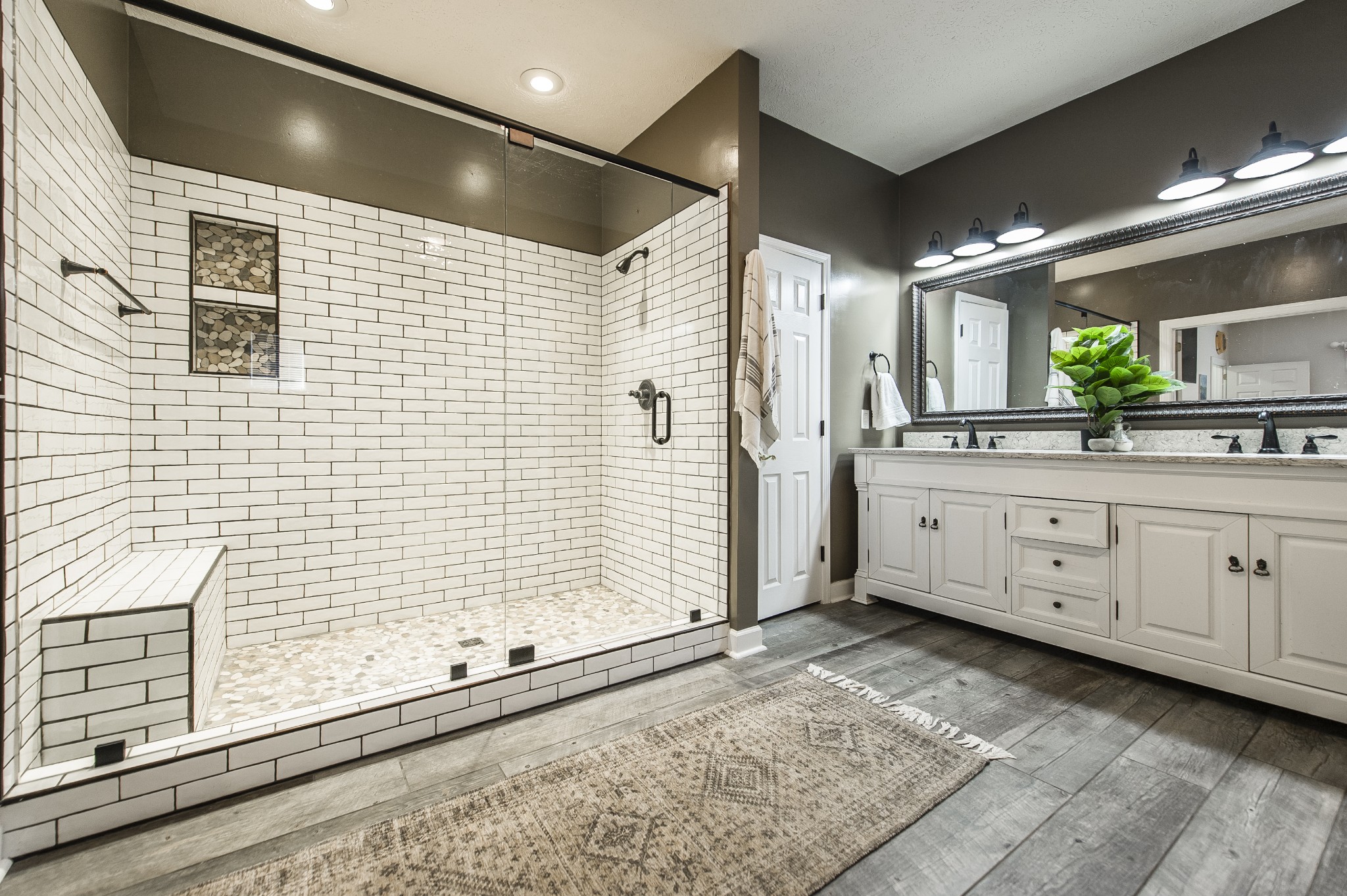4305 Franklin Road Lebanon, TN 37090 - Photo 23 of 67 a bathroom with a double vanity sink a large mirror and shower