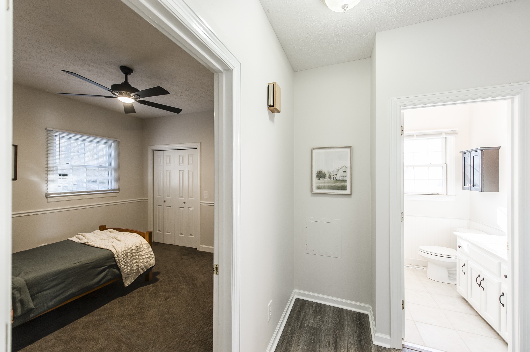 4305 Franklin Road Lebanon, TN 37090 - Photo 32 of 67 a bedroom with a bed and a chandelier