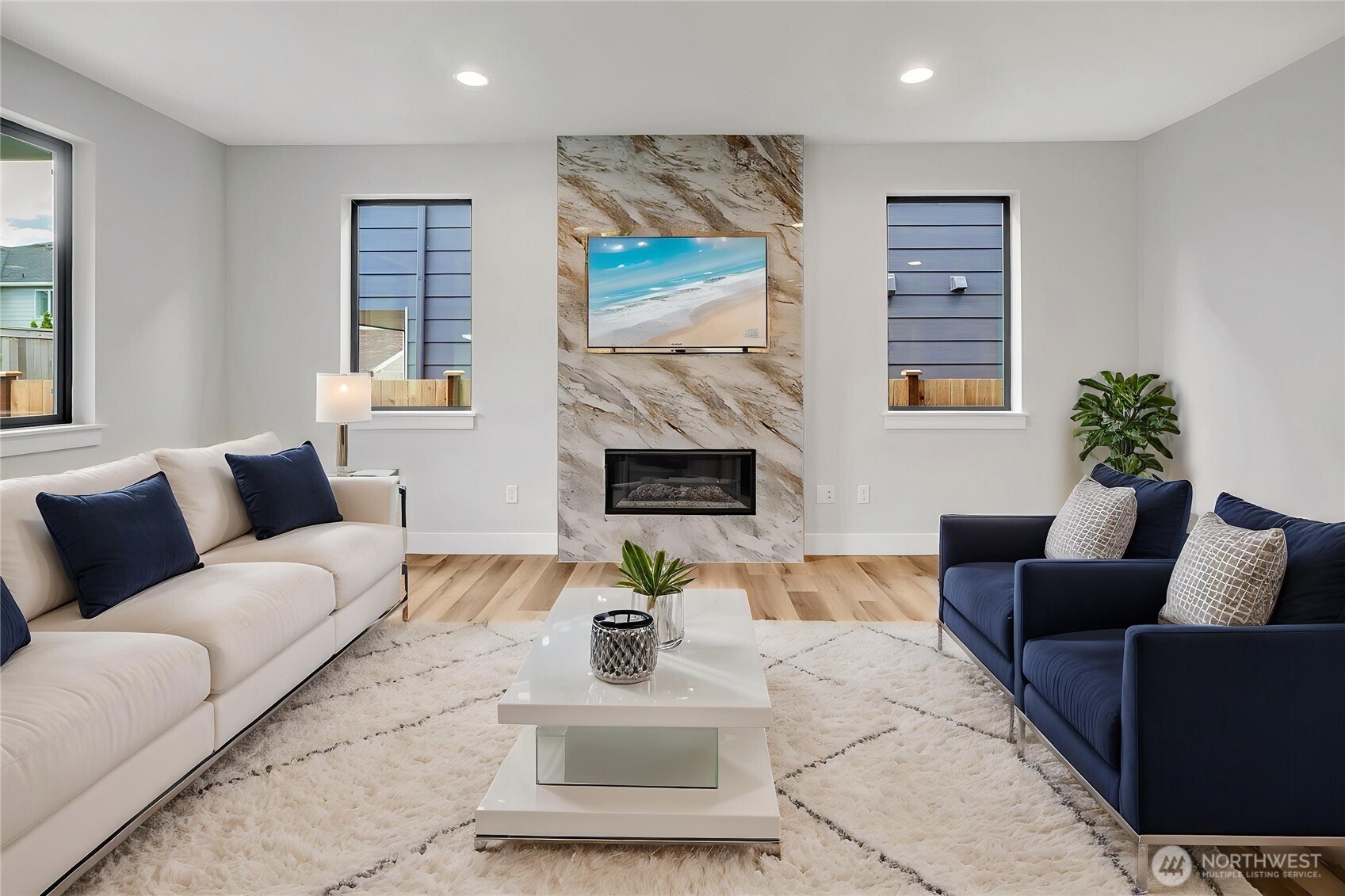 21408 39th Drive Southeast, Unit B Bothell, WA 98021 - Photo 11 of 34 a living room with furniture fireplace and a potted plant