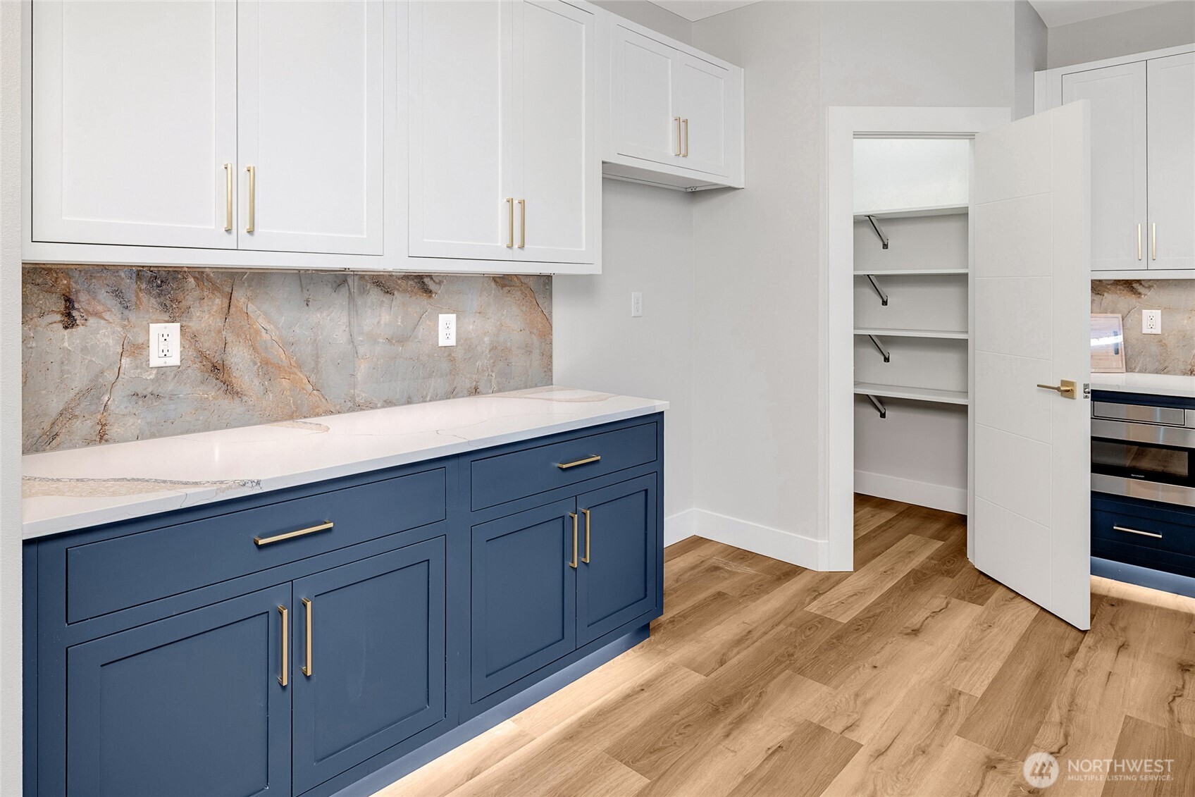 21408 39th Drive Southeast, Unit B Bothell, WA 98021 - Photo 20 of 34 a kitchen with granite countertop white cabinets and stainless steel appliances