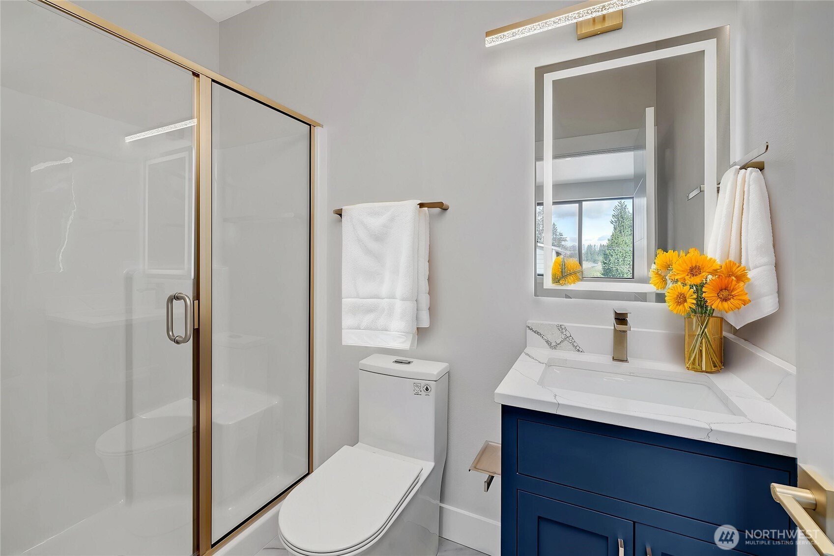 21408 39th Drive Southeast, Unit B Bothell, WA 98021 - Photo 10 of 34 a bathroom with a sink toilet and shower