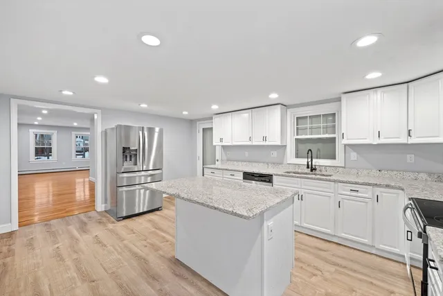 a kitchen with a sink stove and refrigerator
