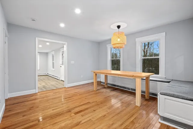 a view of workspace with wooden floor and window