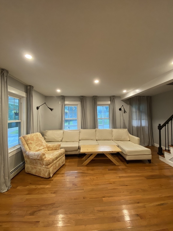 656 Grove Street, Unit 1 Worcester, MA 01605 - Photo 3 of 18 a living room with furniture and kitchen view