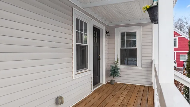 a view of front door and deck of the house
