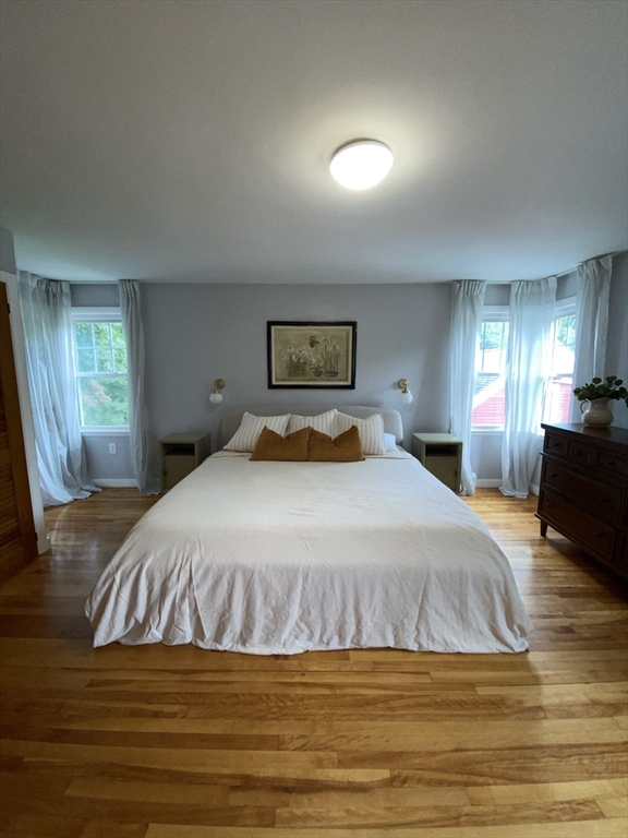 656 Grove Street, Unit 1 Worcester, MA 01605 - Photo 9 of 18 a bedroom with a bed and a view of kitchen