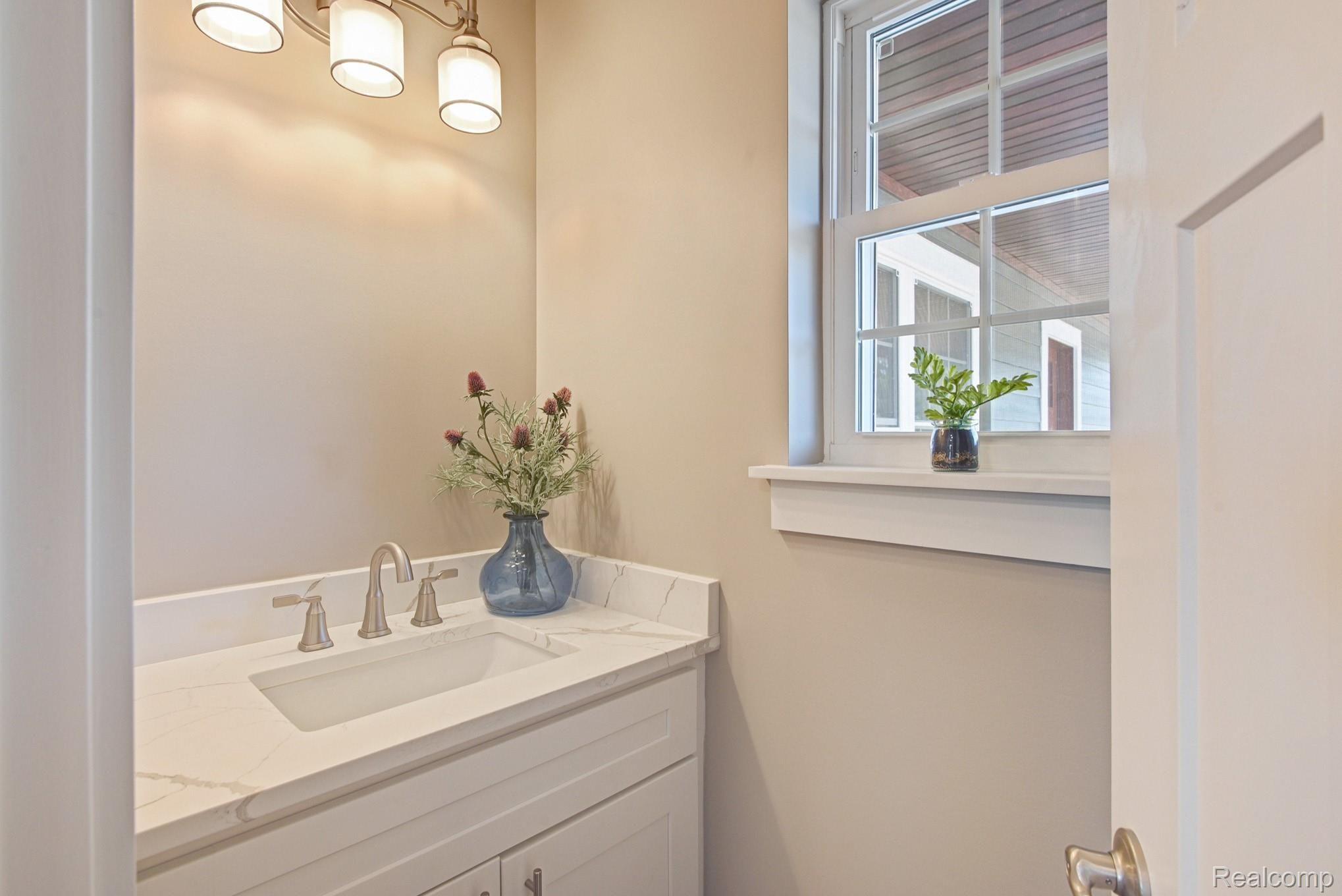 560 Wright Road Howell, MI 48843 - Photo 21 of 30 Half Bathroom just off Laundry and 3 Car Garage.