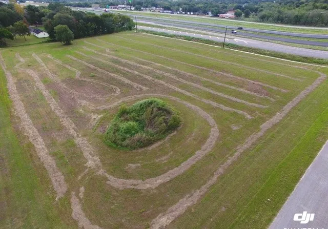 a view of a swimming pool with a yard
